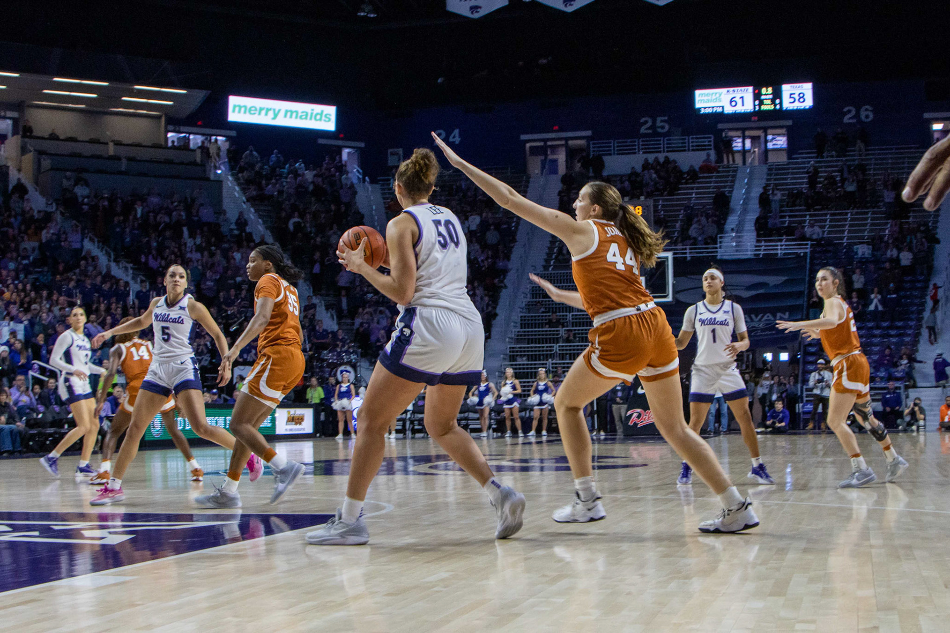 Center Ayoka Lee holds on to the ball as the final seconds of the Texas game wind down. K-State closed the game 61-58 to beat No. 10 Texas Jan. 13, 2024.