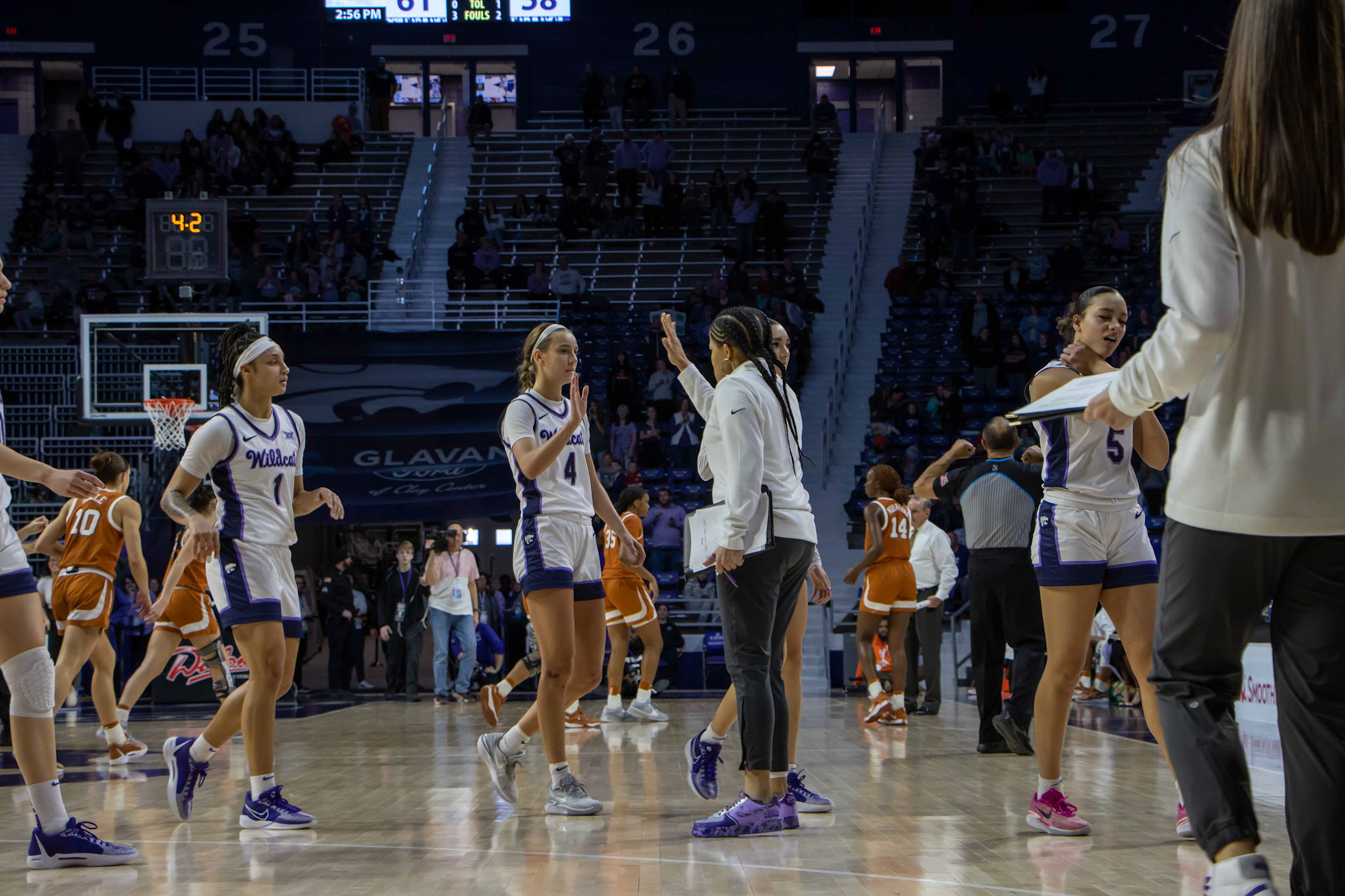Guard Serena Sundell high-fives assistant coach Ebony Haliburton as the team draws up one of its final plays against Texas. K-State closed the game 61-58 to beat No. 10 Texas Jan. 13, 2024.