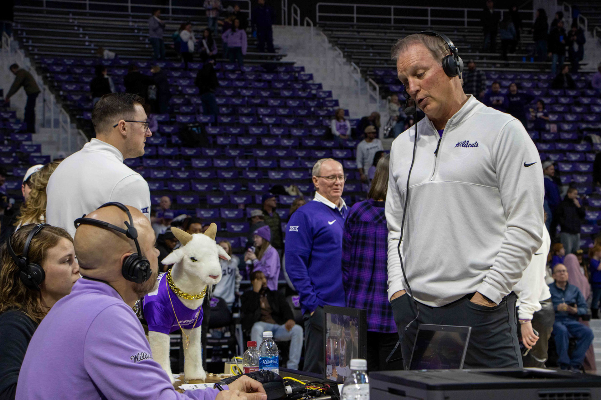 Head coach Jeff Mittie attends to a sideline interview with Gap Goat present after defeating Texas 61-58 Jan. 13, 2024. The Wildcats move to 17-1 on the season and remain undefeated in conference play with the win.