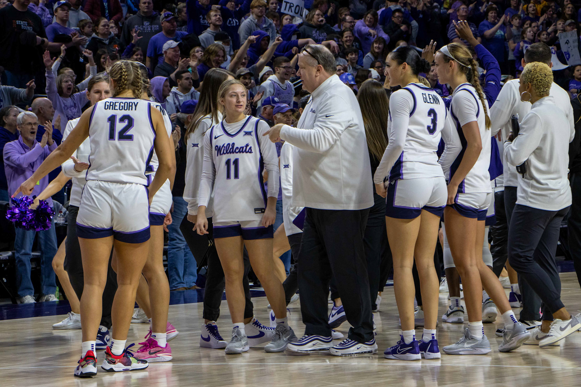 Guard Taryn Sides speaks with chief of staff Mike Nicholson following K-State's 61-58 win over Texas Jan. 13, 2024. Sides ended the game with one rebound, two assists and two fouls.