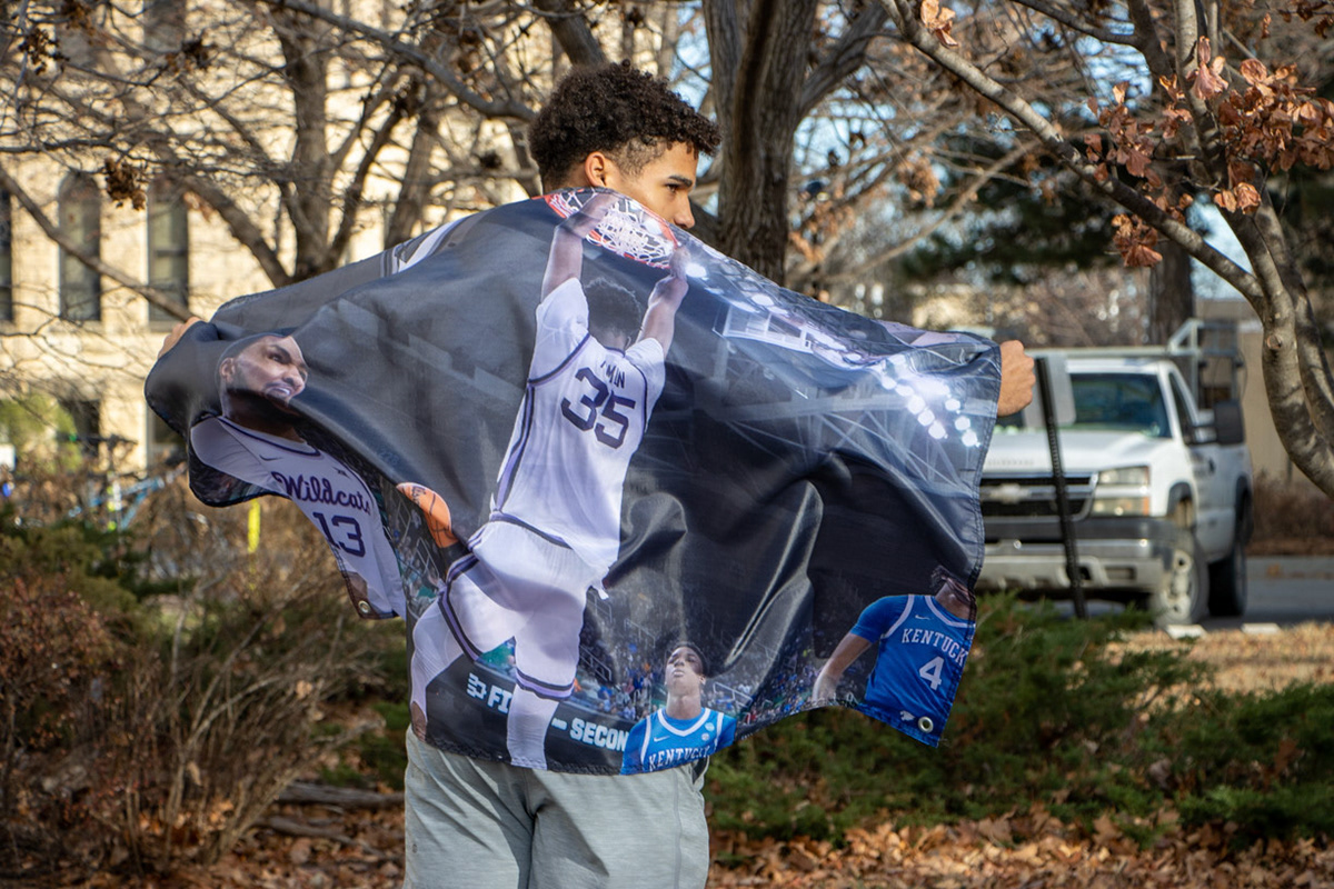 Ryan Buckner, sophomore in accounting, displays a flag he wore to the protest of Nae'Qwan Tomlin dunking. "We believe one of our family members is being oppressed right now by our dictator President Linton," Buckner said. (Featured in the Collegian)