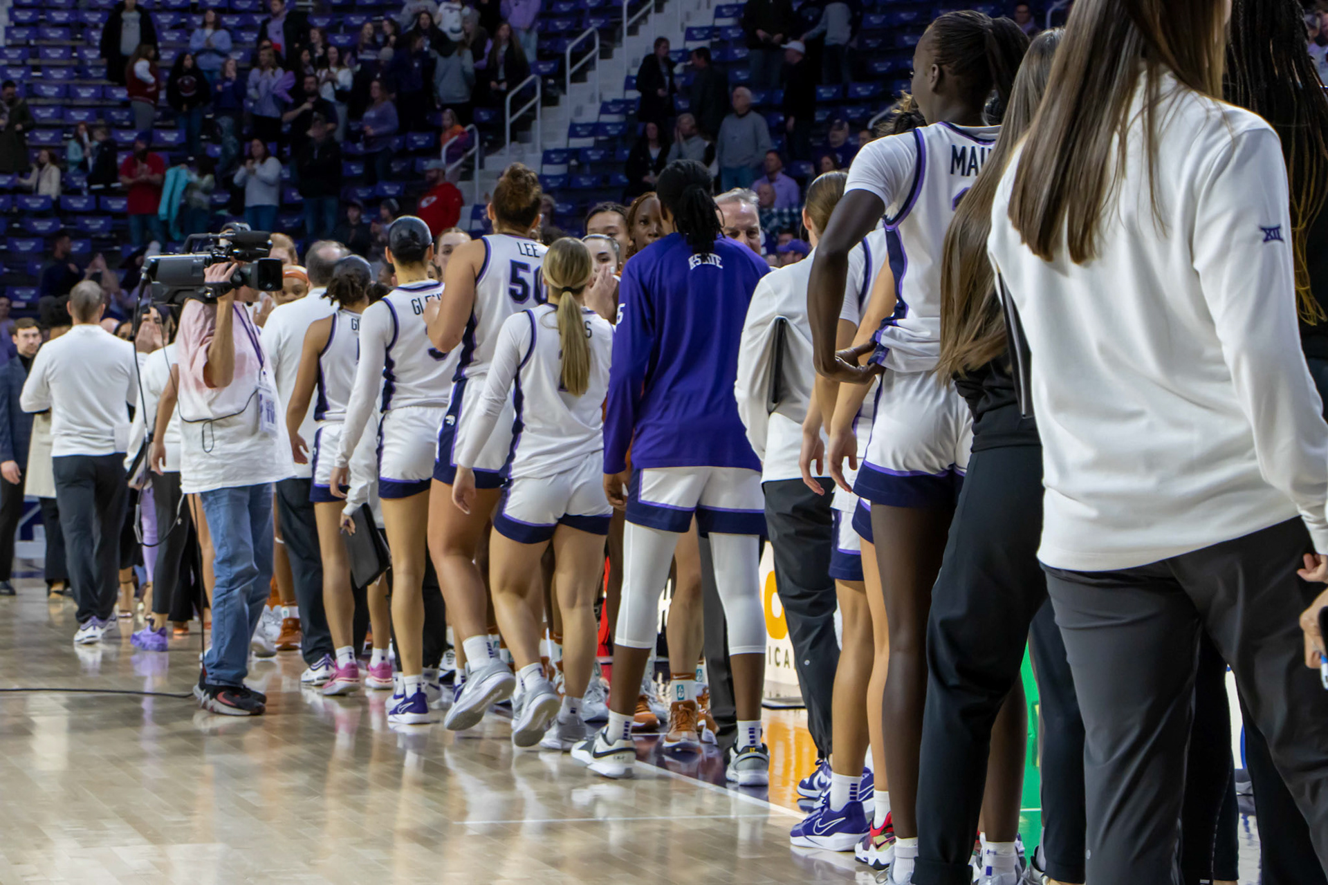 K-State and Texas shake hands following the Wildcats' win. No. 12 K-State beat No. 10 Texas 61-58 Jan. 13, 2024.