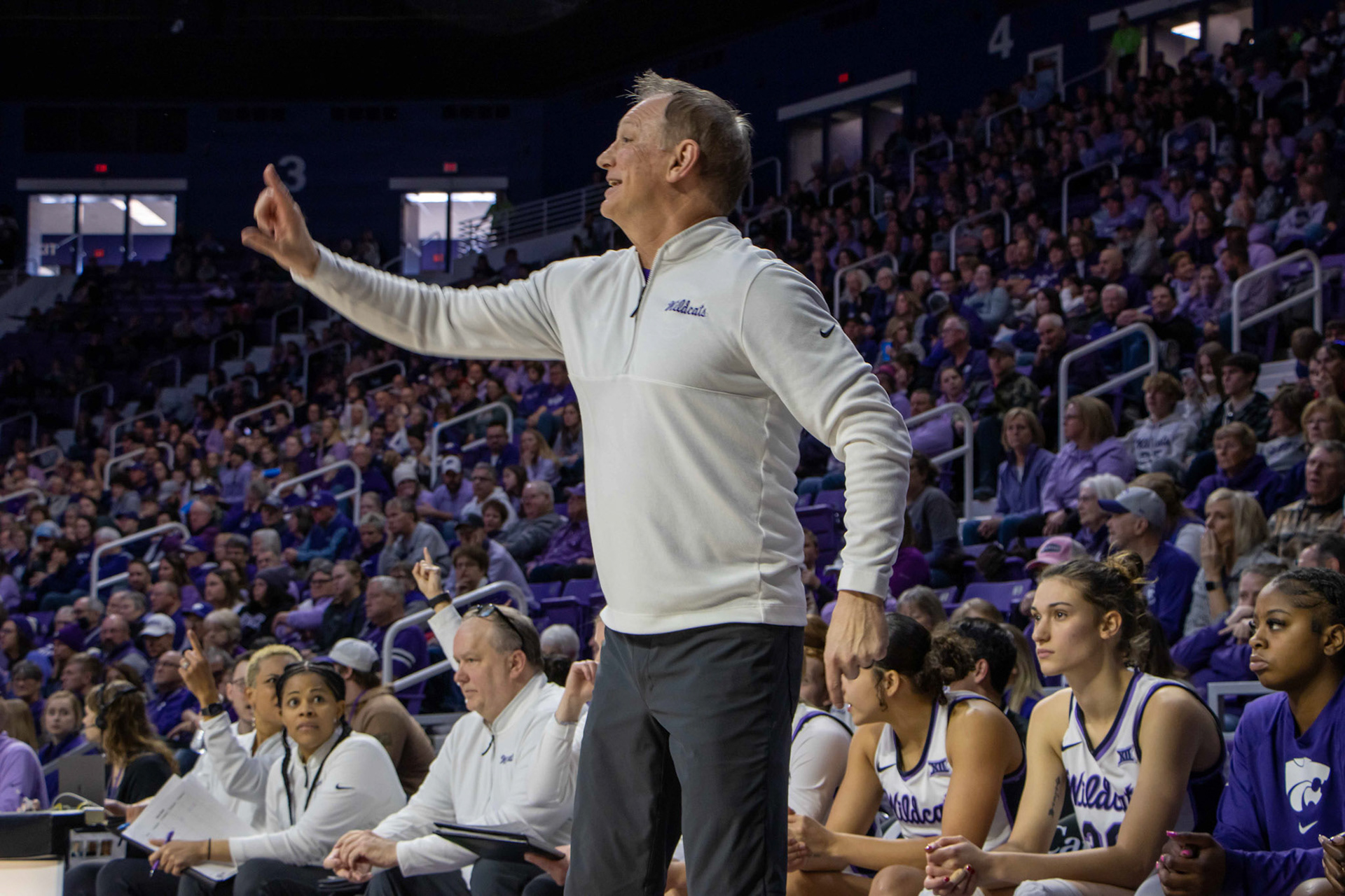 Head coach Jeff Mittie smiles as he directs the offense in the fourth quarter against Texas. No. 12 K-State beat No. 10 Texas 61-58 Jan. 13, 2024.