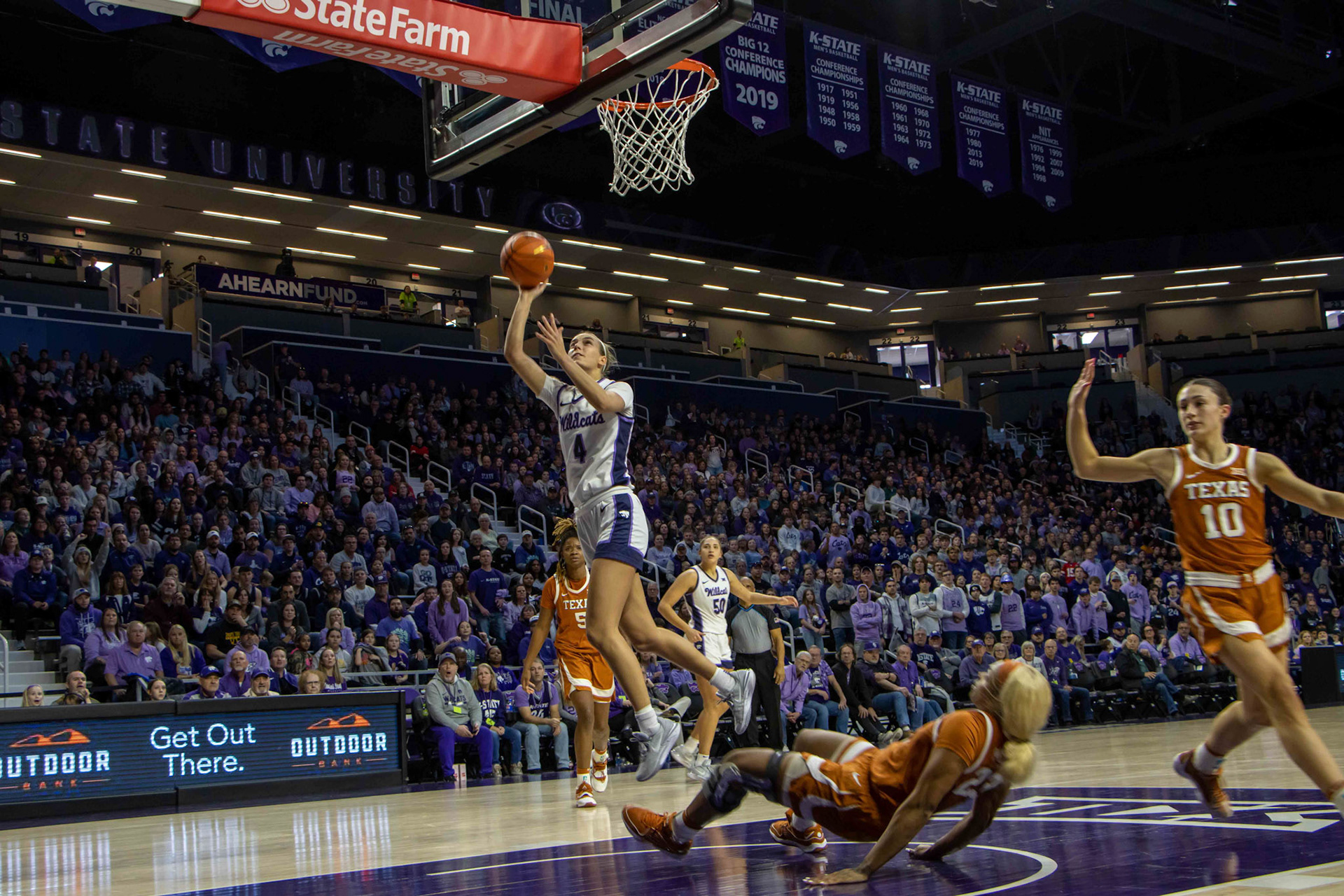 Guard Serena Sundell drops back and hits a 2 in the Jan. 13 victory over Texas. The Wildcat win keeps K-State undefeated in conference play and marks the second top-10 victory for the season. (Featured in the Collegian)