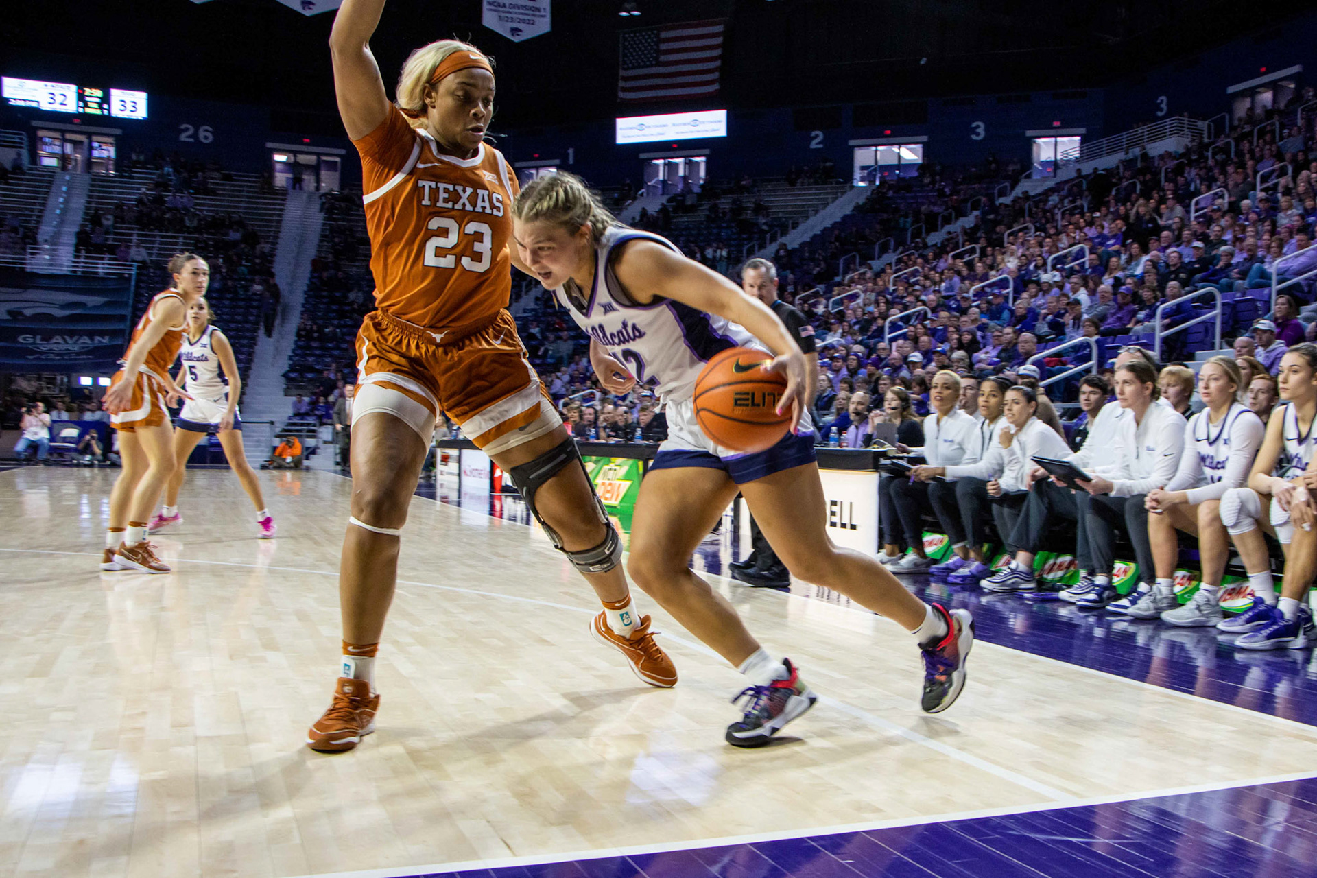 Guard Gabby Gregory drives the ball in against Texas forward Aaliyah Moore. Gregory hurt her ankle on the play, falling down and playing limited minutes the rest of the game.