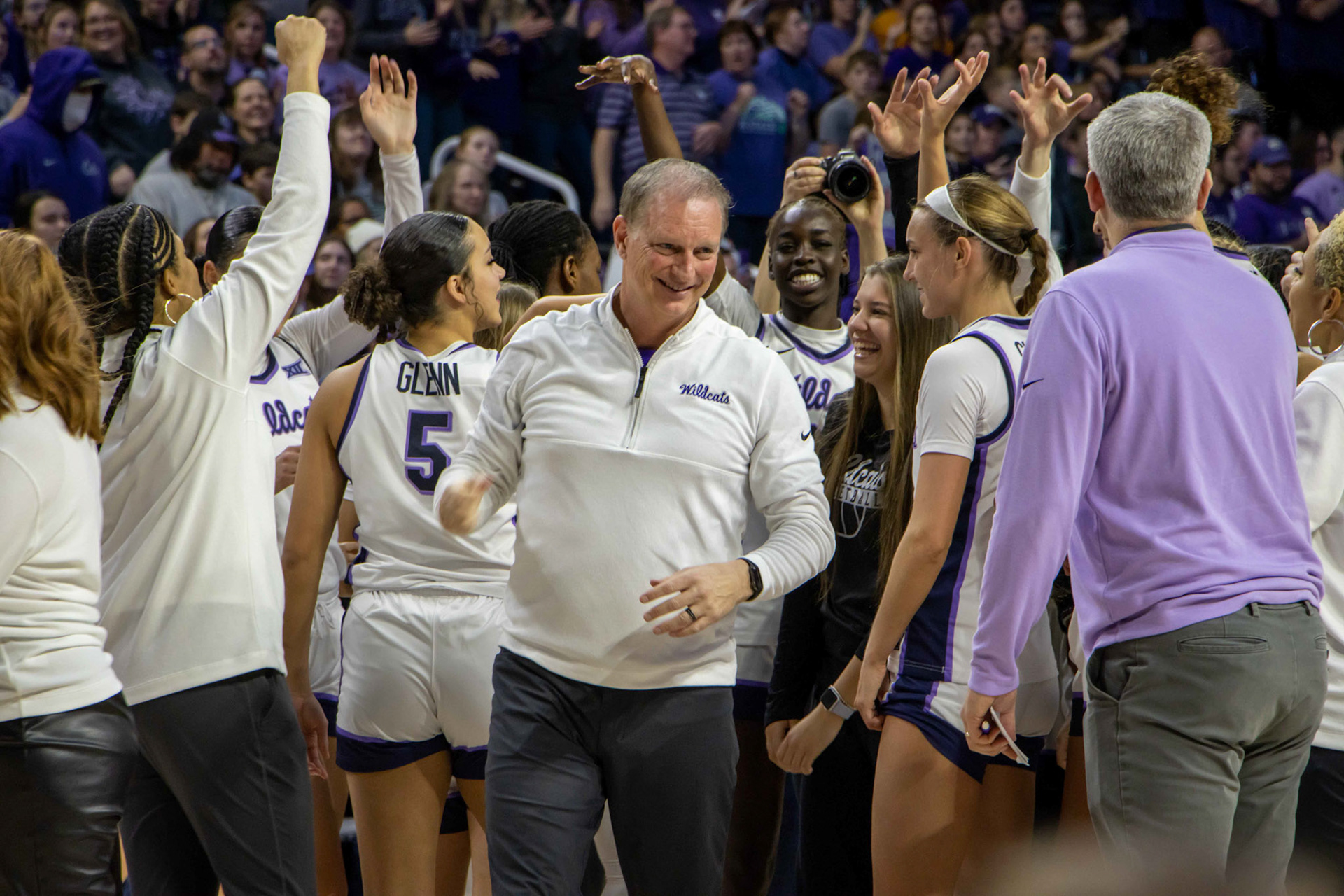 Head coach Jeff Mittie flashes a big grin after breaking it down with his players following K-State's win. No. 12 K-State beat No. 10 Texas 61-58 Jan. 13, 2024.