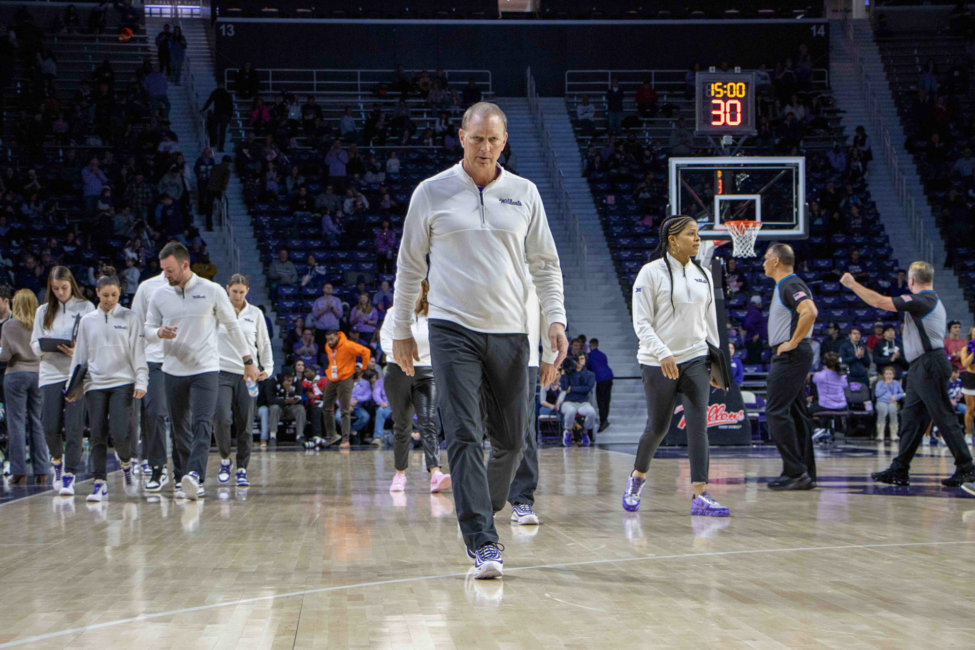 Head coach Jeff Mittie looks directly in my direction as he gracefully walks to the locker room at halftime. No. 12 K-State trailed No. 10 Texas 31-30 at the end of the second quarter.