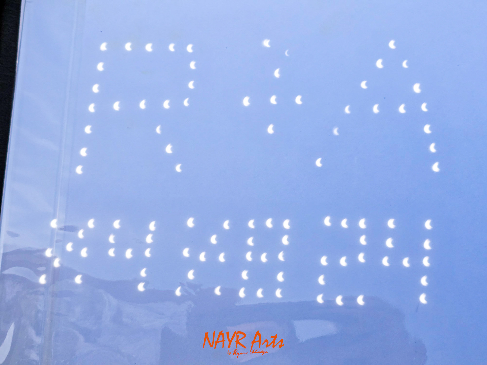 Pinhole Projection - Mine and my wife Ashley's initials and the date of the eclipse: R+A 04 08 24
