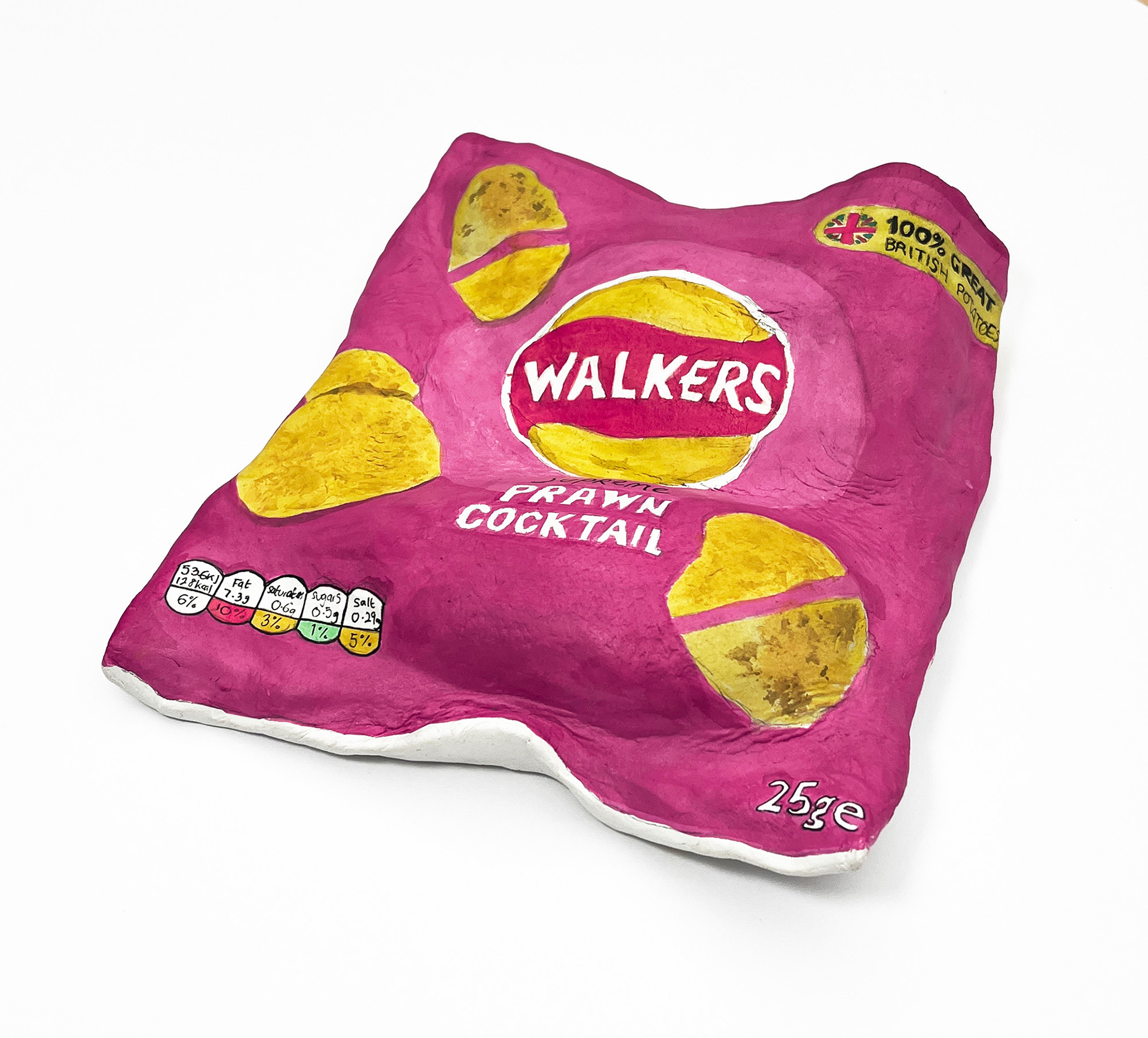Photo of a large clay crisp packet sculpture exploring emotions around junk food