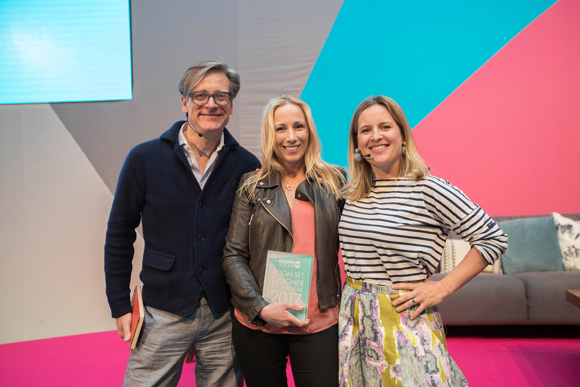 Caroline Oakey (Oaki) with presenters Daniel Hopwood and Sophie Robinson - Grand Designs Live Photo - Set Designer of the Year 2017