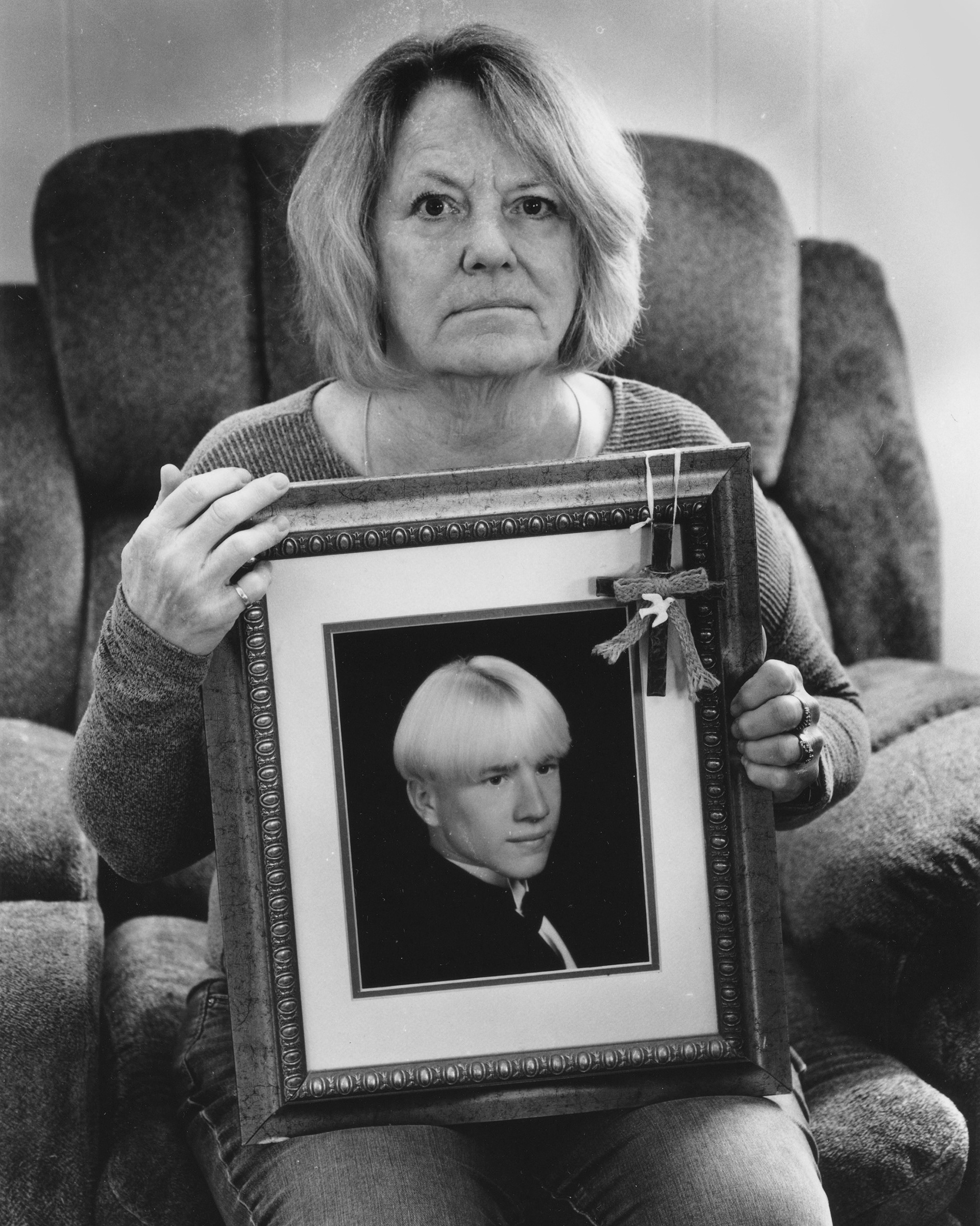 MOM HOLDING A PHOTO OF BRIAN | 2021