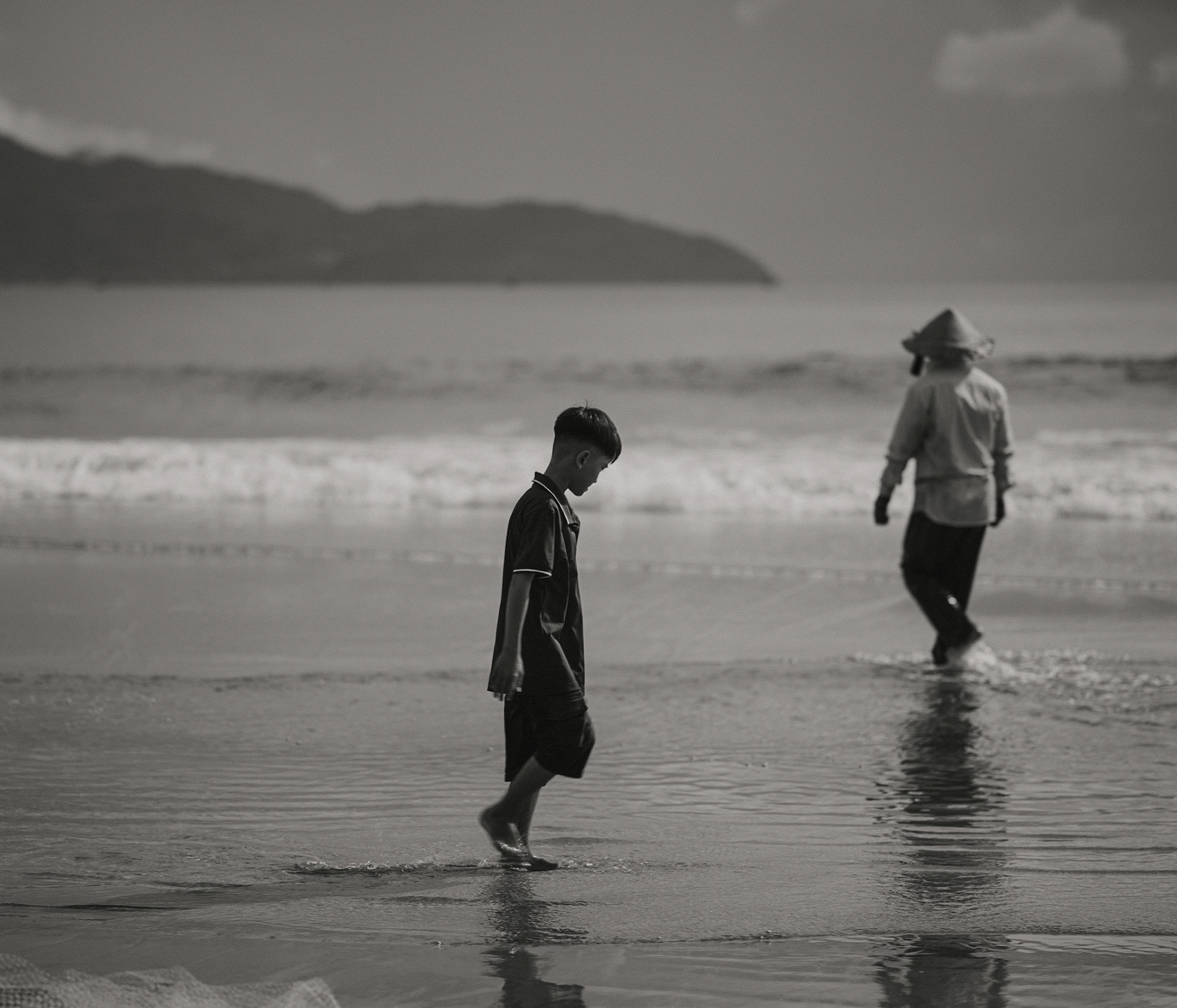 Boy and Fisherman on Mỹ An Beach, Đà Nẵng, Oct. 2025