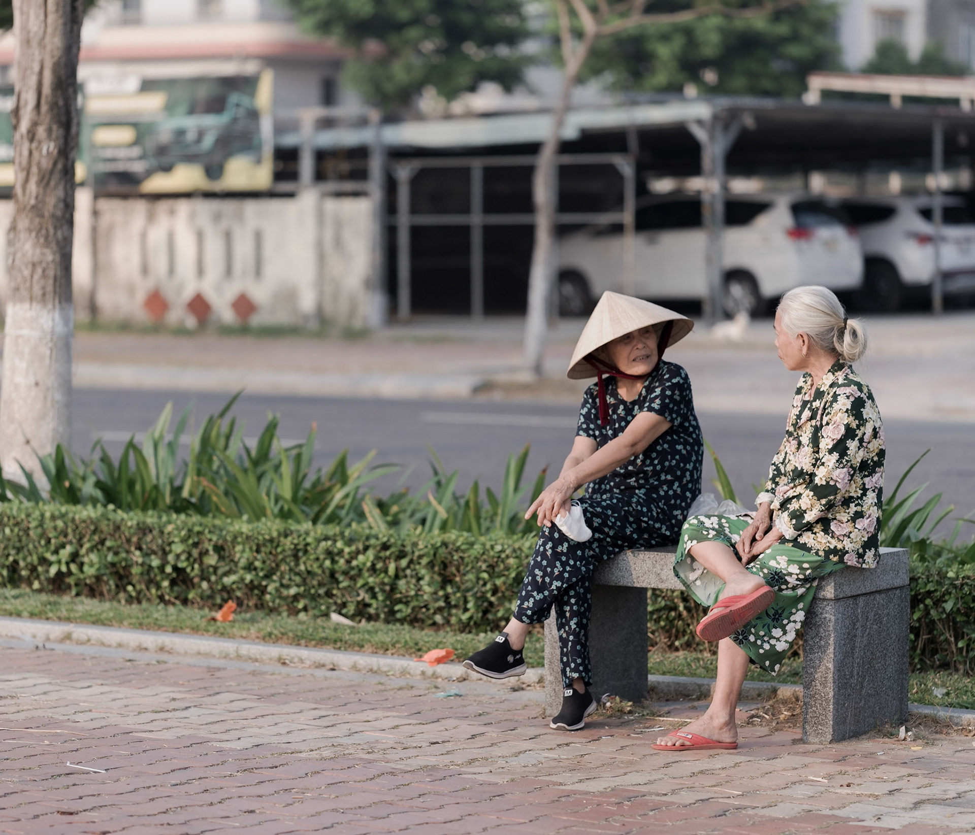Women Talking on a Bench, Đà Nẵng, Apr. 2026
