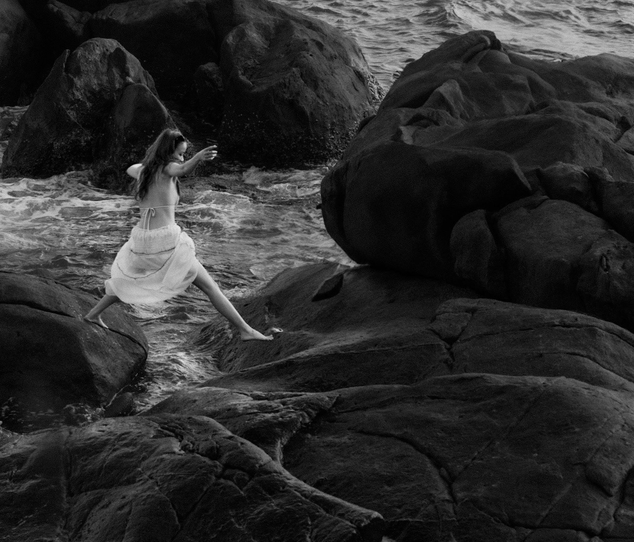 Woman Jumping Between Rocks on Sơn Trà Peninsula, Đà Nẵng, Apr. 2025