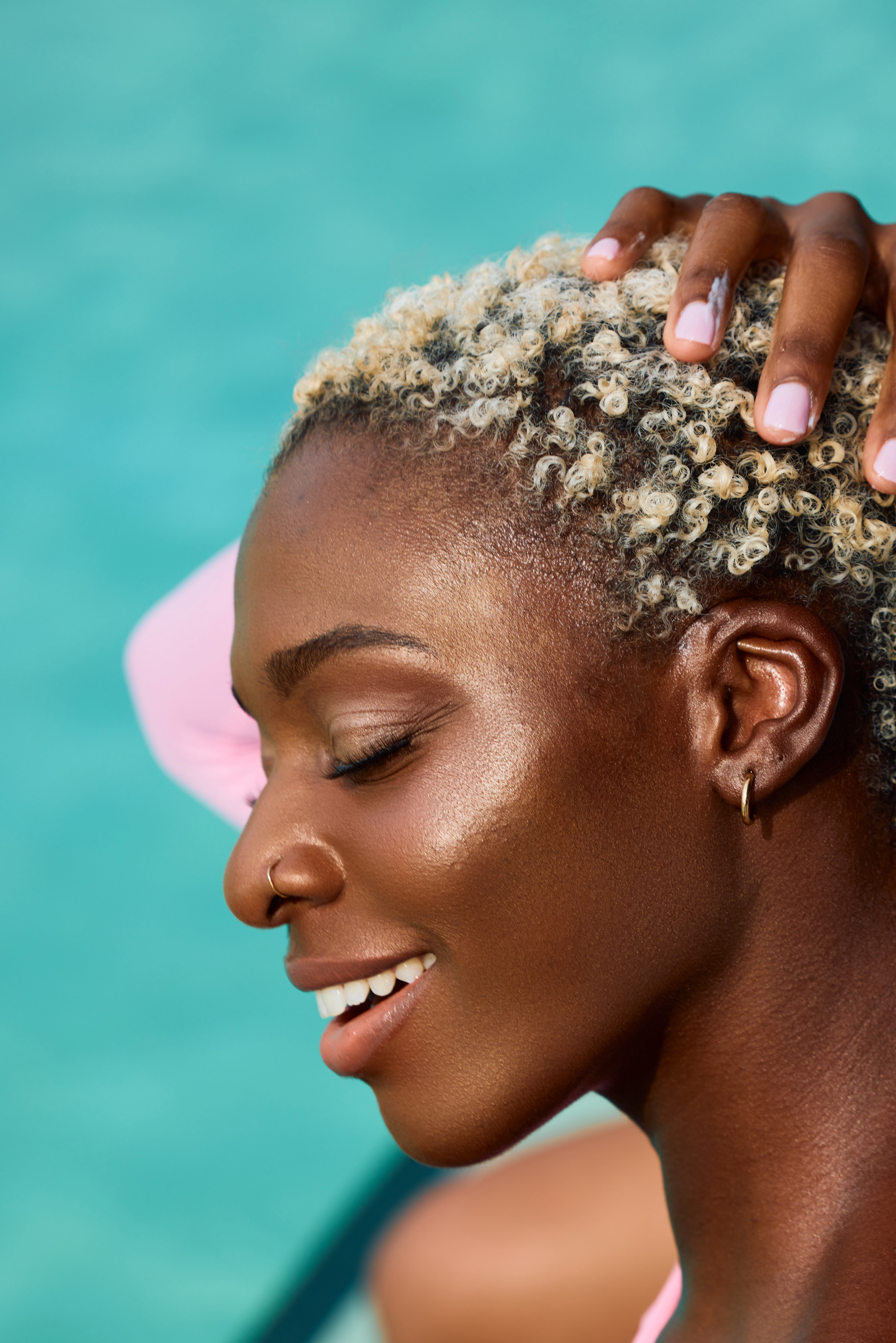 Beauty product portrait highlighting Blessed Bananas hair oil in commercial skincare campaign.