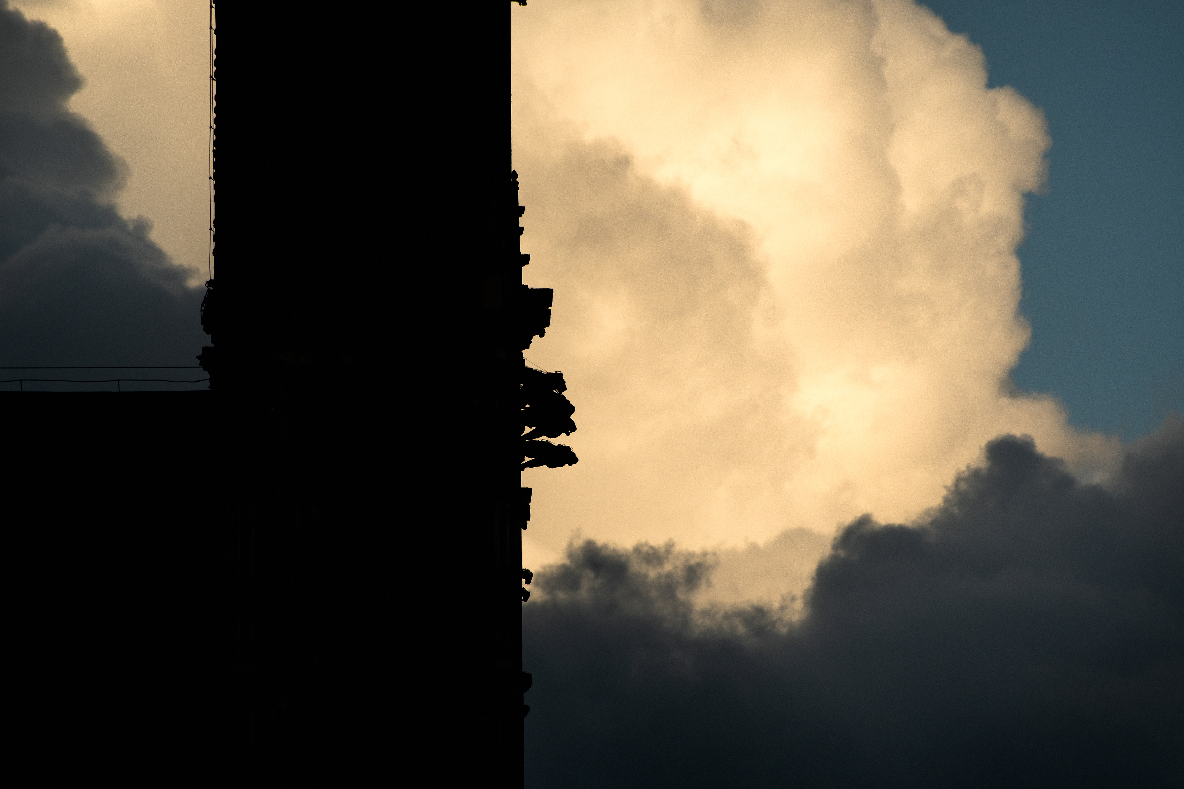 Orvieto gothic Duomo against a backdrop of warm-toned clouds
