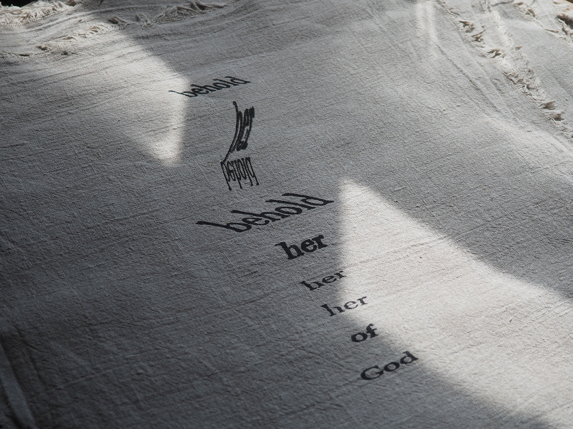 “Bioregional Dialect: Automatic Verse in Iron Gall Ink” Helen Armstrong, Textile/Screen-print/Pigment Making, 2026 “A selection from an extensive series of cut-up poems that have been screen-printed onto raw organic linen using a historically accurate adaptation of a 16th-century iron gall ink recipe.  (more info on my website https://helencarmstrong.com/projects/bioregional-dialect-iron-gall-ink and also https://helencarmstrong.com/projects/irongallink)  This work is a text-based inquiry that employs the cut-up technique and a combination of digital and analogue manipulation to destabilise and reconfigure an archaic text.  Utilising a re-creation of a historic ink made from locally foraged oak galls to carry the words, the process opens up opportunities for dialogue with unauthored voices. By deconstructing and reassembling source material, an opportunity arises to peer behind the veil between personal perception and non-human agency. Through this process, ultimate control over the outcome is surrendered to facilitate the becoming of chaos, randomisation, and the other, inviting the beholder to decode a broken language.” https://helencarmstrong.com 