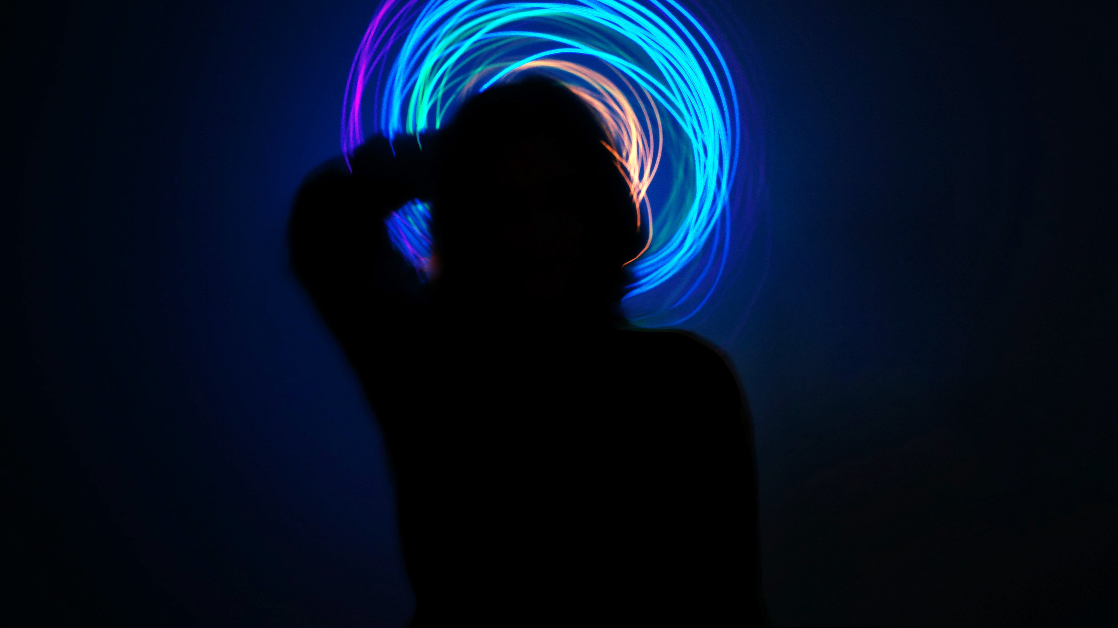 “Fluorescent Thoughts”, digital photography Kate Aries @katearies_artist Photographic series 2021 Kate has used rainbow lights to capture a visual energy, creating these light art performances that evoke events beyond their creation relating to mental health and queerness.