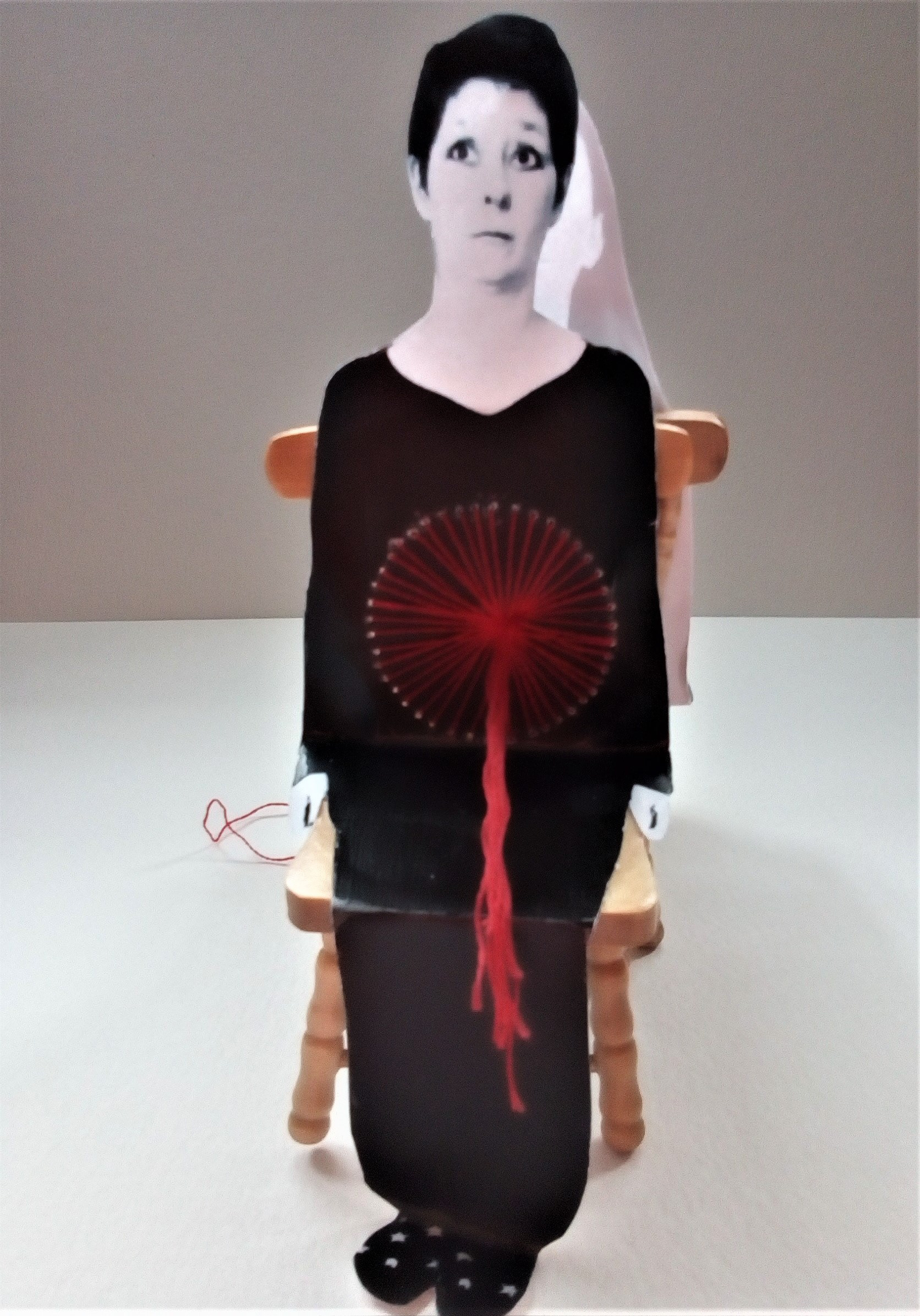“Hostage to Domesticity”, Jane Gibson 2021 Photomontage, embroidery thread and dolls house chairs, 10 x 5 cm