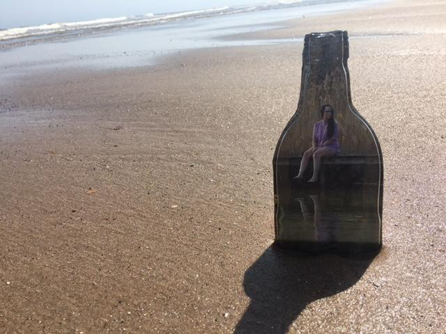 ‘’Life cycle’’ Laura Charlotte Bates, Photography, glass, kiln work, T-shirt soaked in red wine, 2020 ‘’ Depicting the isolation felt during lockdown and turning to alcohol to get through it for better or worse. Alcohol sales rised by 67% during the first 3 months. The beach, more importantly the sand repersent time, time has slowed down for us all and we all wonder how much we have got left. Articulating the inner complexity of feeling trapped, not only literal in the bottle, but in our own human experiences.’’ @theory_of_a_dead_angel