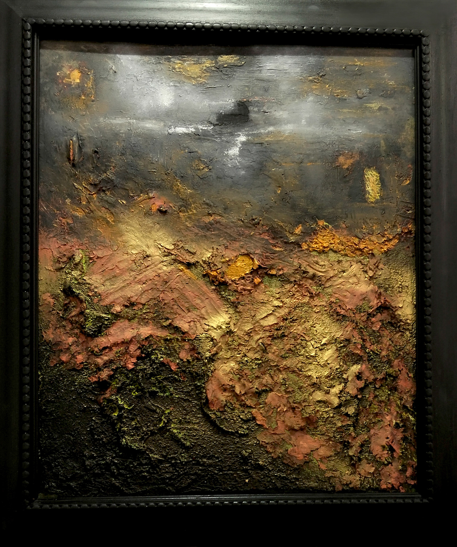 “Soft Ruins” Yasmin Grant, Oil textured clay, 2026  “My painting evokes a landscape suspended between memory and erosion — a place where ruins do not collapse harshly, but soften into the earth that created them. The grey sky hangs heavily above the scene, quiet and atmospheric, pressing a muted stillness across the composition. Beneath it, the red clay terrain breathes warmth through its deep mineral tones, giving the landscape an ancient, weathered presence.  The gold added moves subtly through the surface like traces of forgotten light caught within the ruins, while black adds depth and shadow, suggesting remnants of structures dissolving into time. Hints of green emerge delicately through the textured layers, like signs of life reclaiming what has been abandoned. I wanted to create a rich texture of the paint to reinforce the feeling of decay transformed into beauty — the ruins are not broken, but softened by wind, earth, and memory. The landscape feels both desolate and alive, carrying a quiet tension between permanence and disappearance.”  www.yasmingrant.co.uk @yasmingrantstudio60