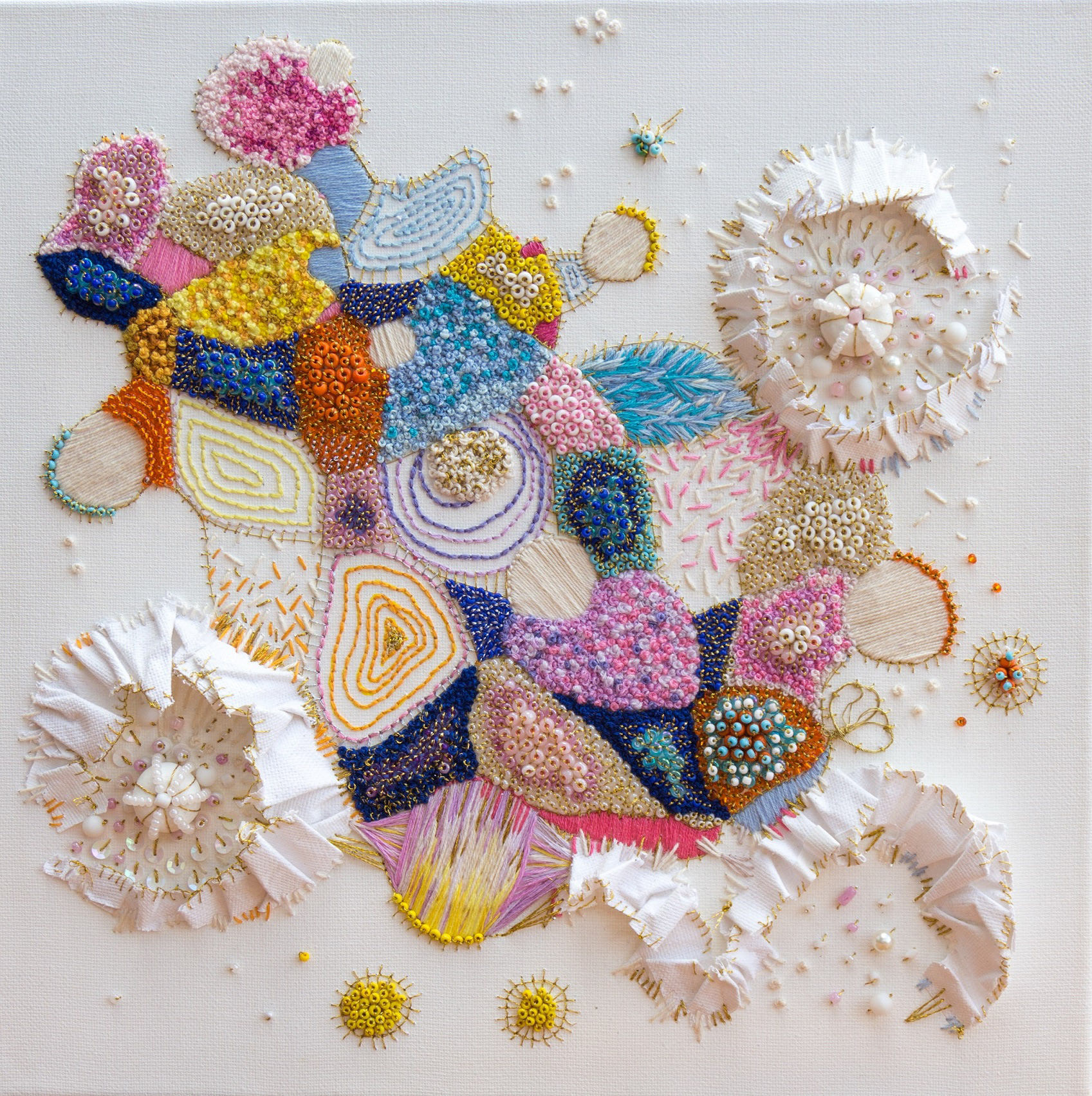 “Complete Infiltration”, hand-embroidered with upcycled beads, yarns, gold threads, salvaged materials such as waste canvas paper, champagne wire, clay beads, 30.5cm x 30.5cm x 1.5 cm Manoela Grigorova @mojoandmuse Plastic is all around us. It infiltrates every part of our lives. From the plastics in our oceans, in the stomach of whales, to the micro-plastics in fish, shrimp and zooplankton and even in the beautiful corals in our plastic-infiltrated reefs. It's in the water we drink and the air we breathe. It is all around us in our bins, kitchens, living spaces, in the phones that we use, in the wet wipes we use on our children and in the detergents we buy. The gold thread that makes up most of this piece is made of plastic and it surrounds and infiltrates these coral-like sculptures. Will we ever be rid of this material for good or will it just consume us?