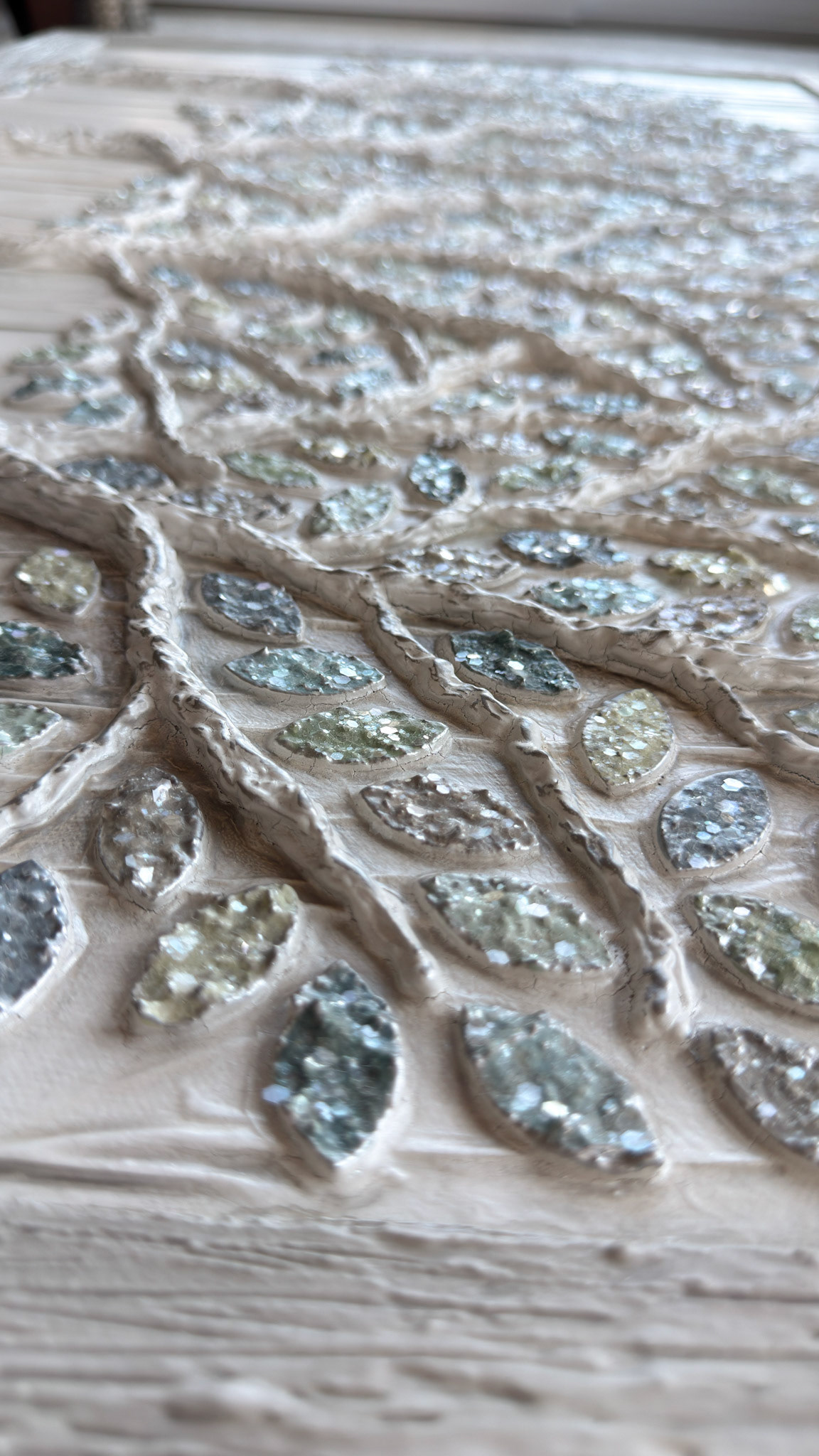 raised, sparkling leaves