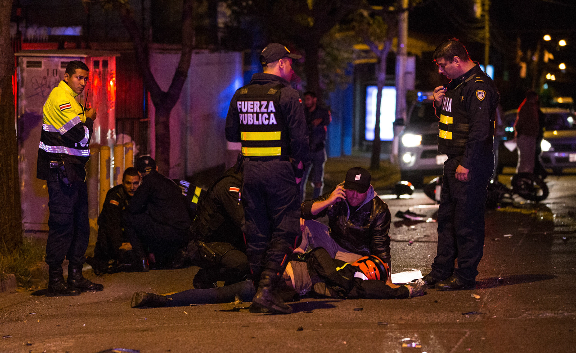 A motorcyclist was injured after colliding with police. 