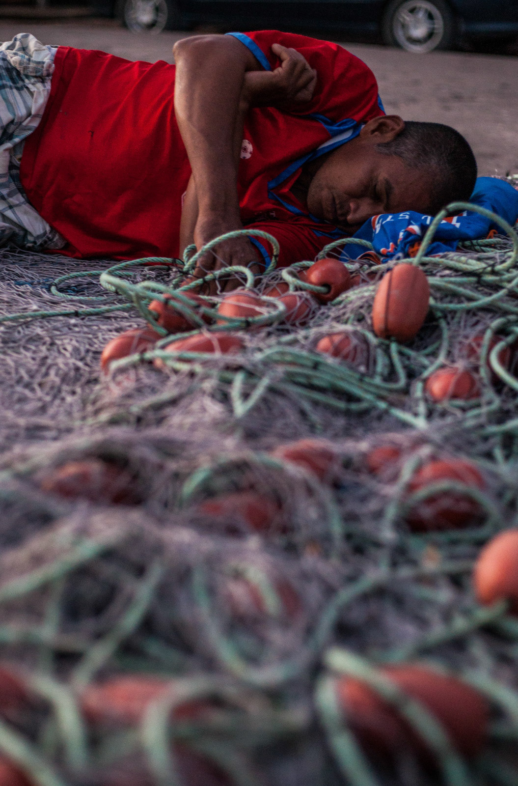 A local fisherman in Puerto Nispero takes a nap before heading out to sea.