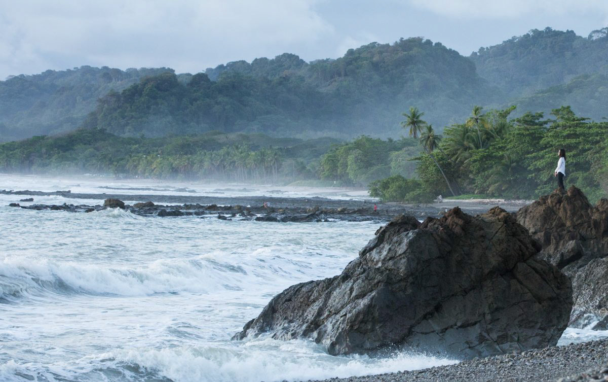 A woman overlooks the sea in Santa Teresa, Costa Rica.