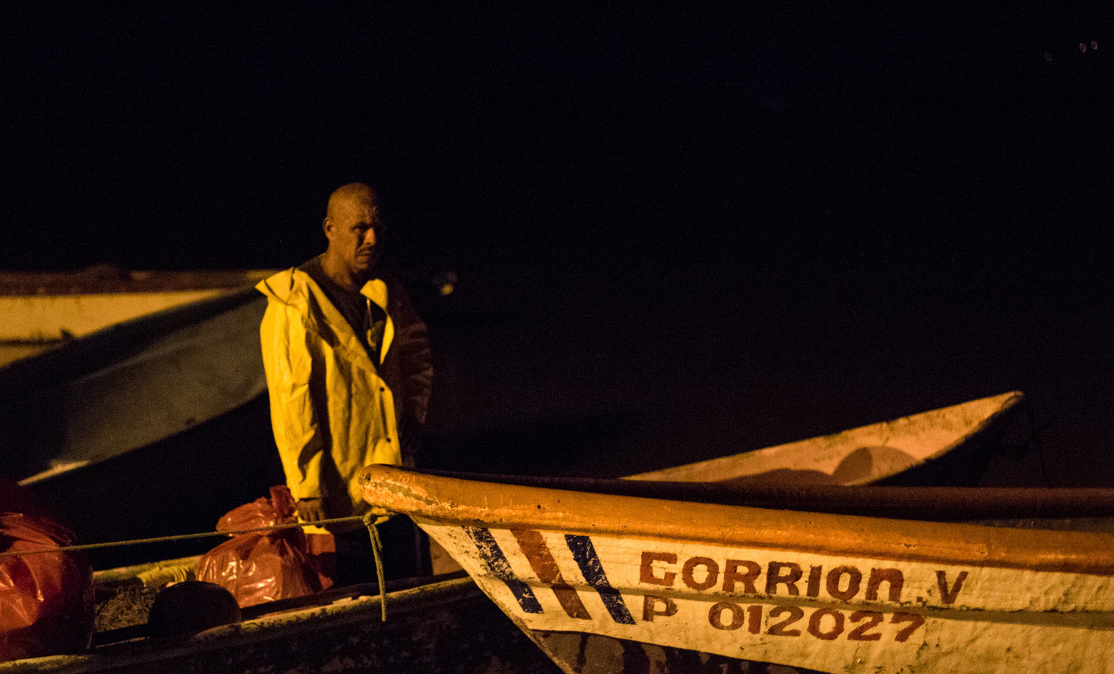 A fisherman in Puerto Nispero getting ready for a night of fishing.