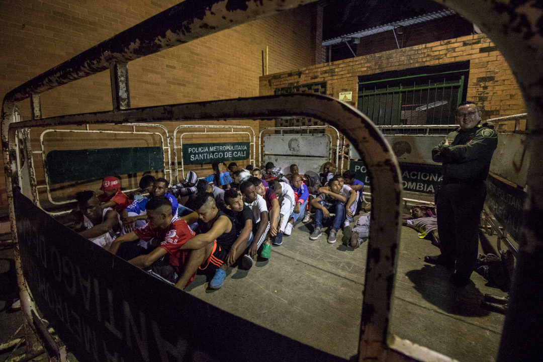 Men detained during a police roundup in Cali, Colombia.