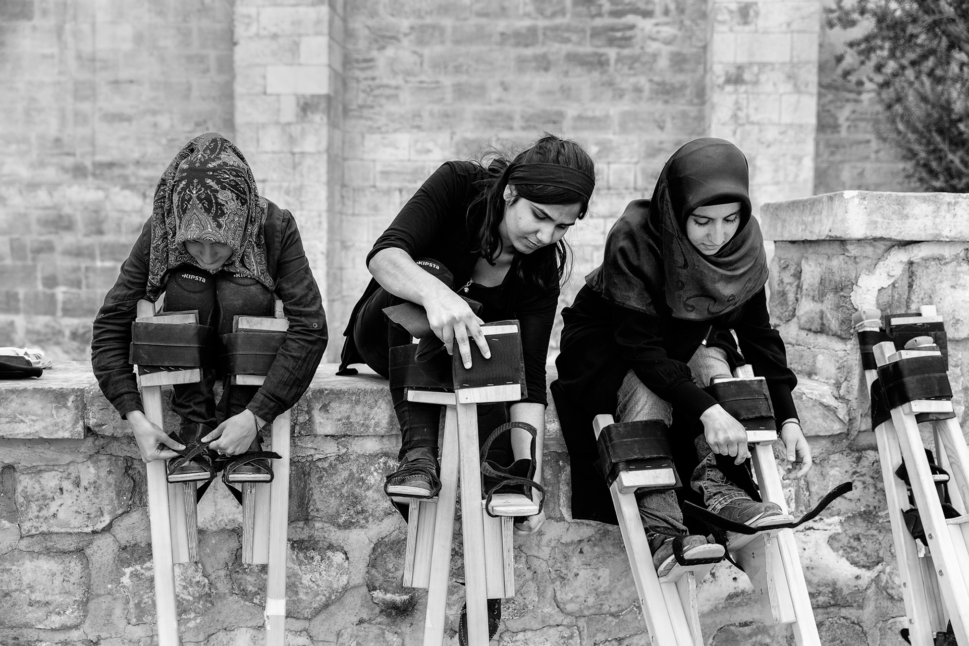 Local residents of Mardin, especially young girls willing to learn walking on stilts.