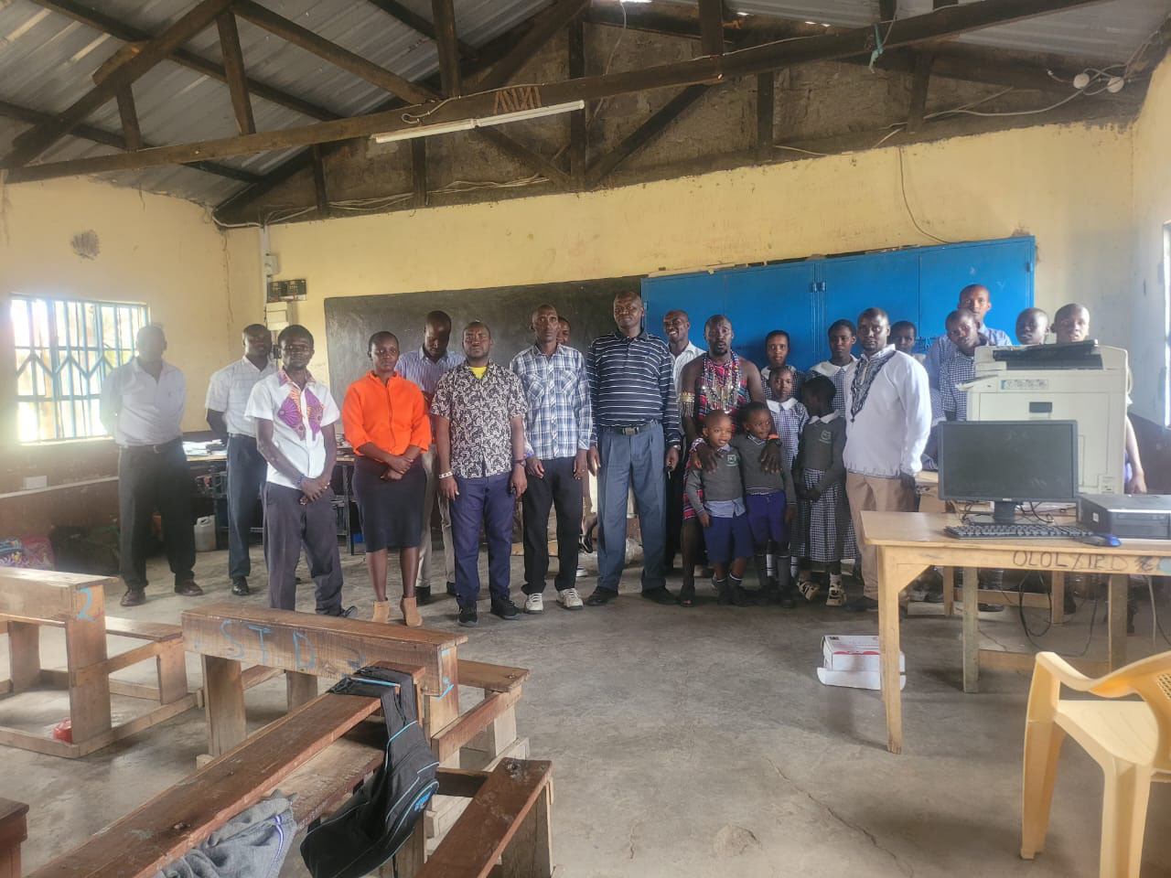 Staff and board members with the donated computer and printer that were provided by generous donors.