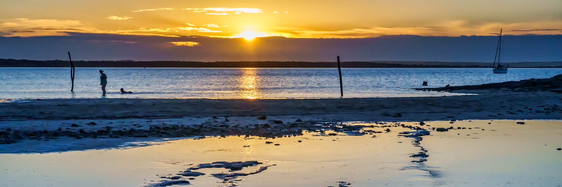 The sun sets across the Bay at Baudwn Beach, making for a gorgeous sunset and peaceful evening.