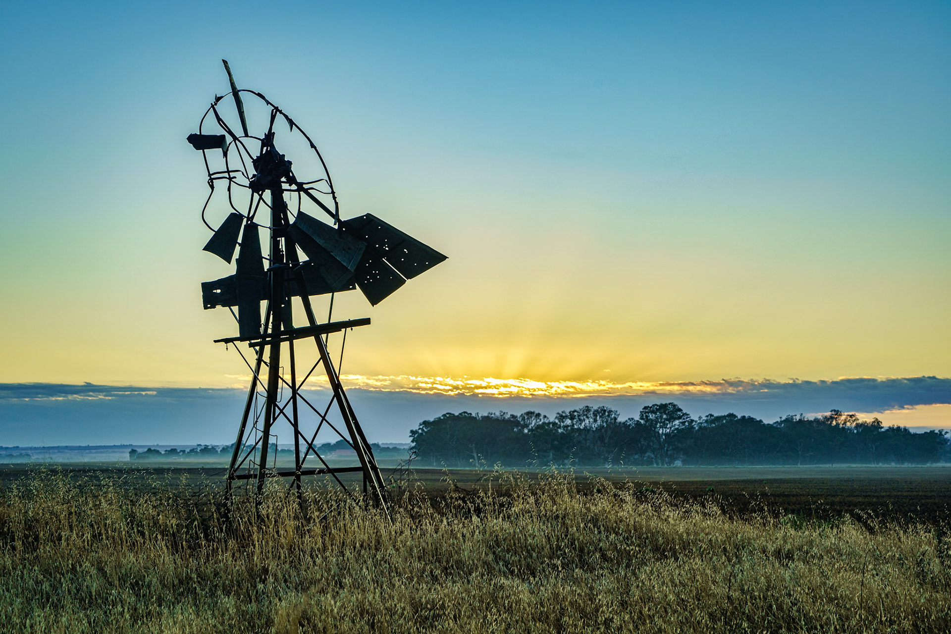 The old windmill was used to pump groundwater for gazing sheep and cattle. Now broken and part of a bygone era.