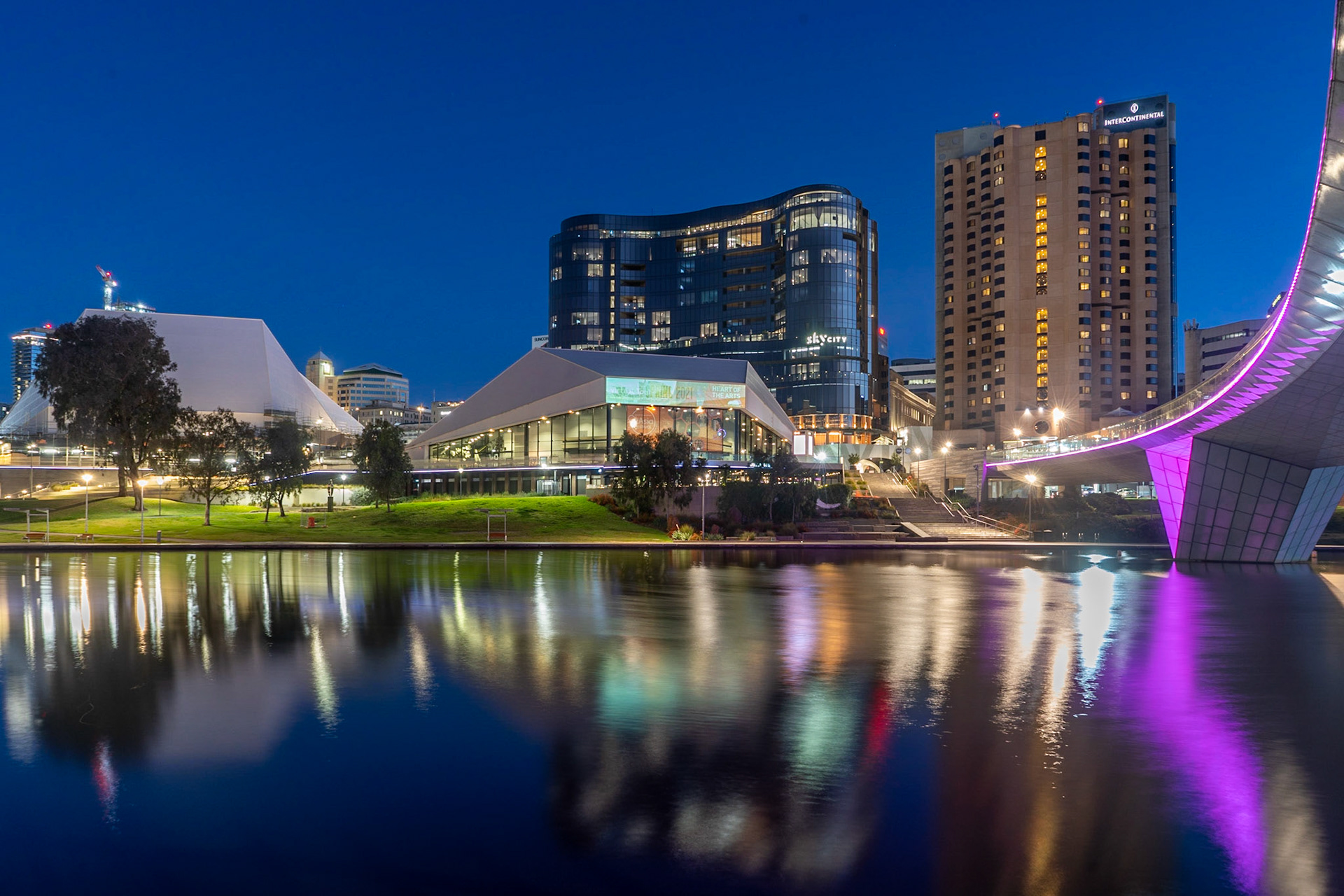 View of the night lights from the bank of the River Torrens in Adelaide.