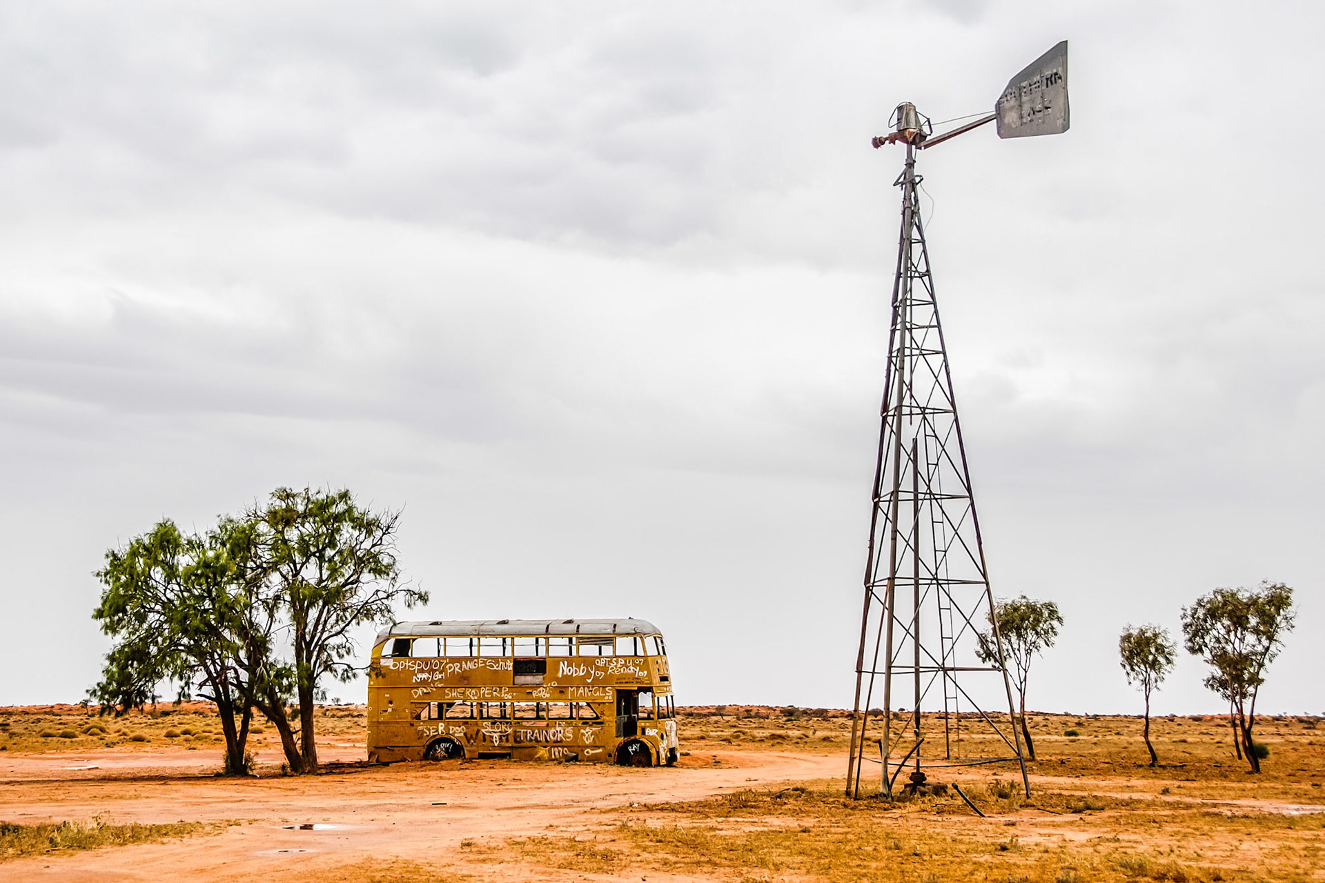 This double decker bus has been abandoned next to an outback windmill near Cameron's Corner in South Australia.