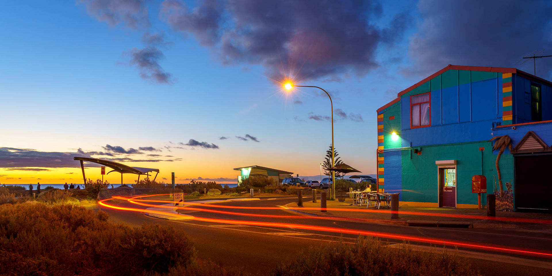 After dark at this seaside village in southern Adelaide. Come for a night, stay for a while.