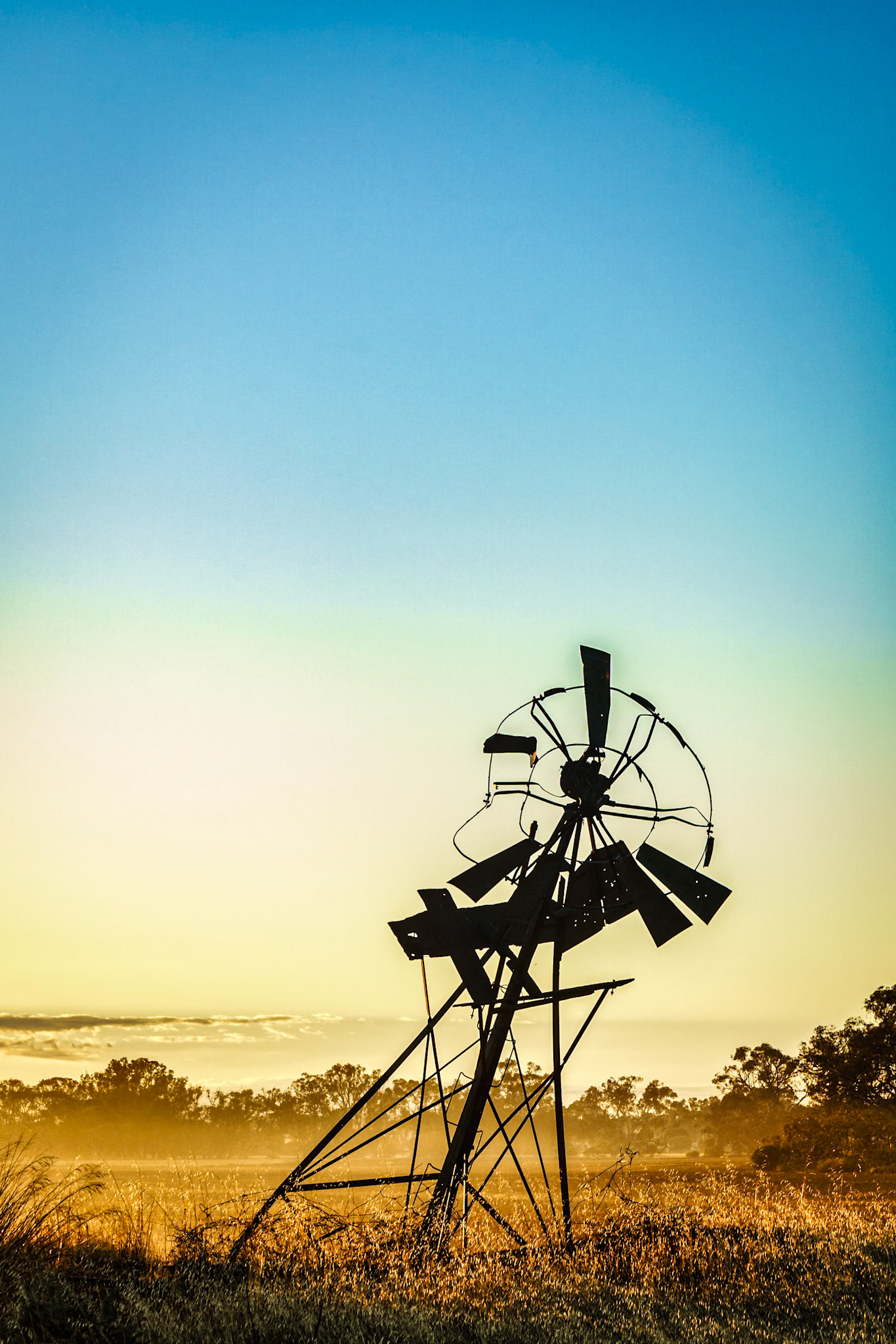 The old windmill was used to pump groundwater for gazing sheep and cattle. Now broken and part of a bygone era.