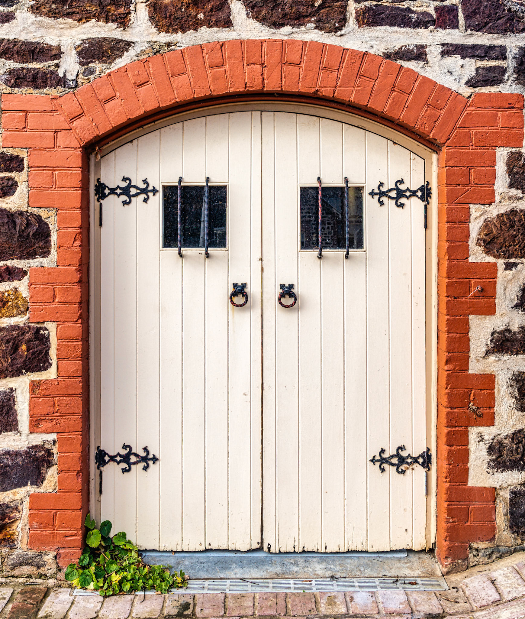 Wooden door leading to the wine cellar in Tanunda. Decorative hinges and door handles.
