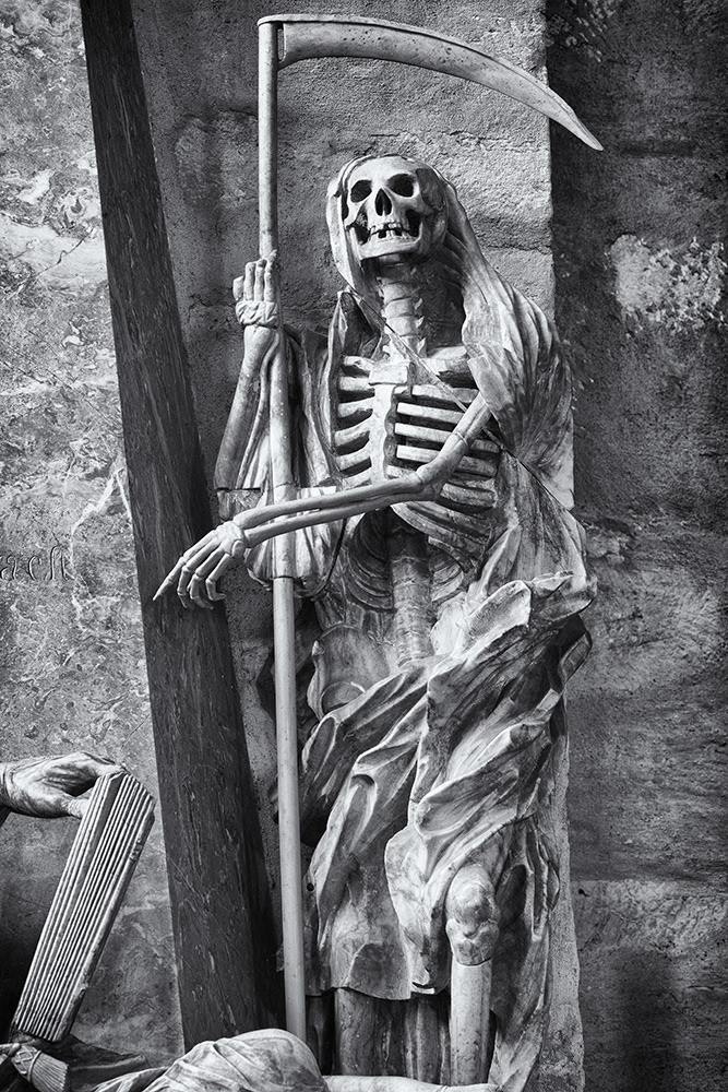 Death, depicted as a skeleton dressed in a robe and hood, holding a scythe, refers to the transience of earthly endeavors.