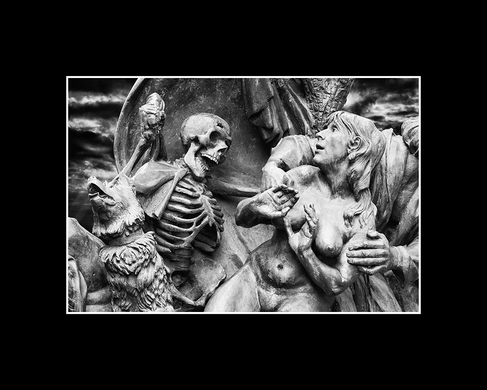 Adam and the naked Eve are driven out of paradise by a sinister skeleton man with a whip. A wolf howls eerily.