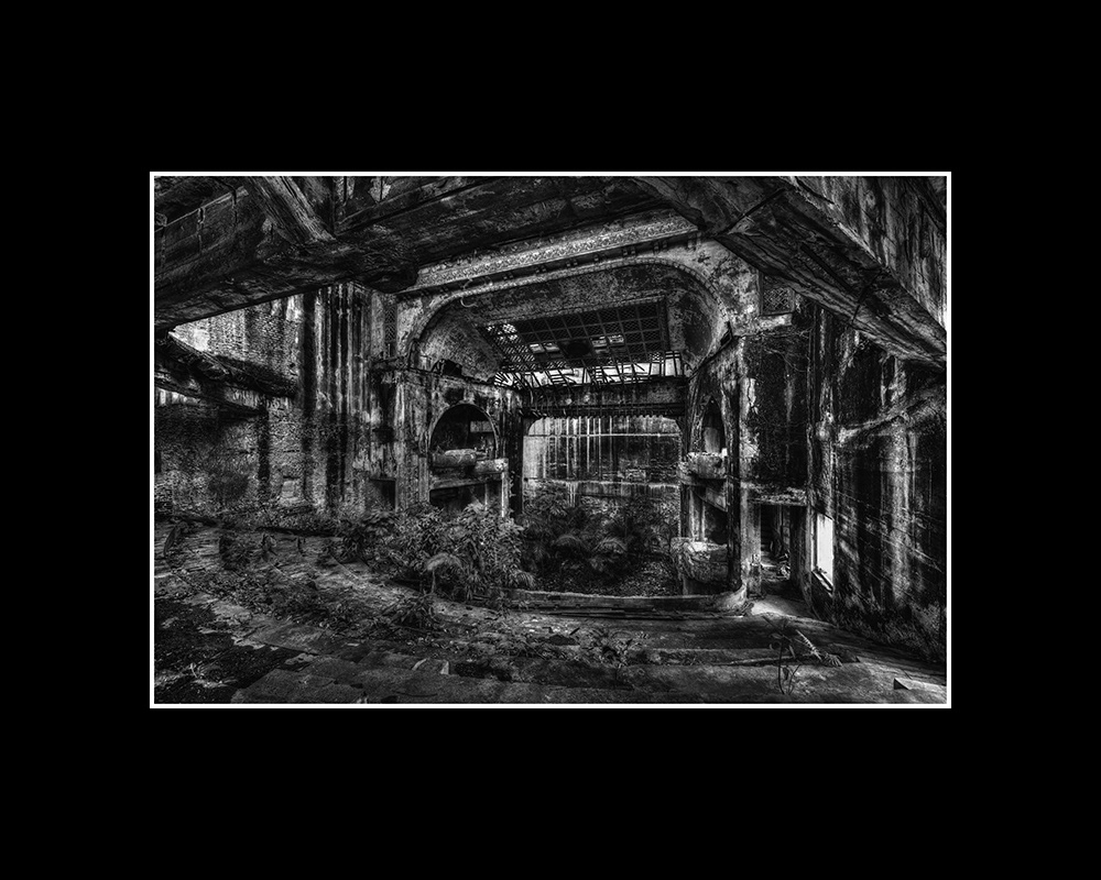 Interior view of the ruins (with a collapsed ceiling) of the famous theater, built in 1870, which once seated 2,400 visitors.