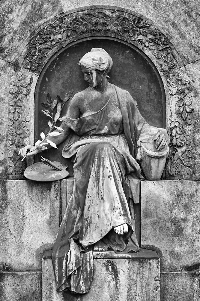 An elegant lady in a long robe, with her breast partially bared, holds a palm frond as a paintbrush and clasps an urn.