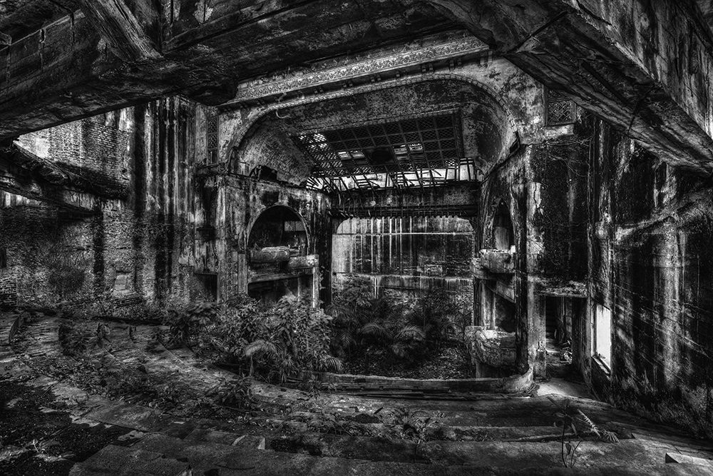 Interior view of the ruins (with a collapsed ceiling) of the famous theater, built in 1870, which once seated 2,400 visitors.