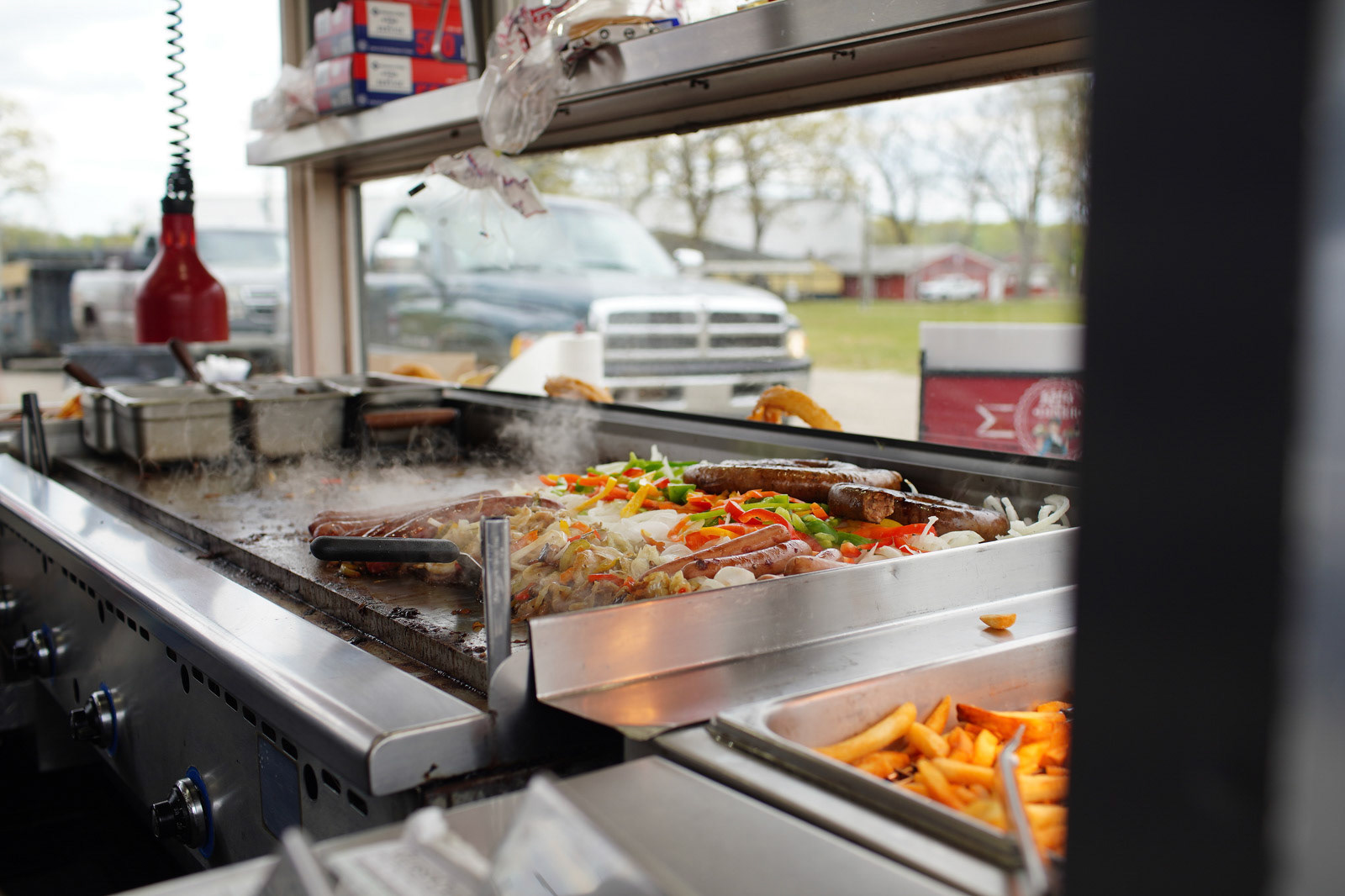 A flock of vehicles make their way around Allegan County Fairgrounds throughout the day for ‘Fair Food Mania’ in Allegan, Michigan on Saturday, May 15, 2021. Visitors get a chance to get some delicious fair food from several different concessions while remaining in their vehicles. (Rodney Coleman-Robinson | MLive.com)