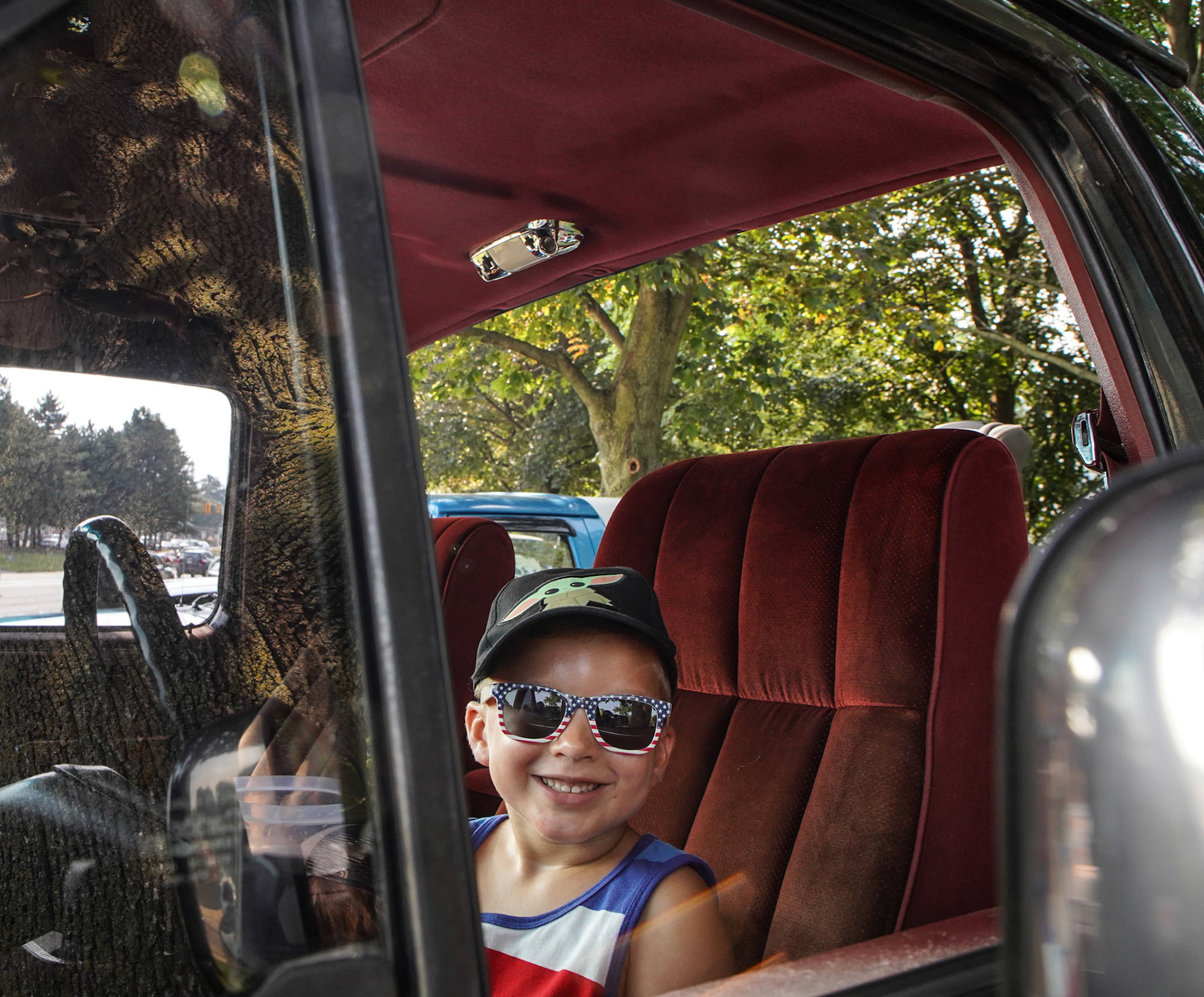 Jake Winowiecki, 5, of Waterford poses for a photo in a Bronco truck at the Woodward Dream Cruise in Ferndale on Saturday, August 21, 2021. The Woodward Dream Cruise, the world's largest one-day car event returns after taking a break last year due to COVID-19.