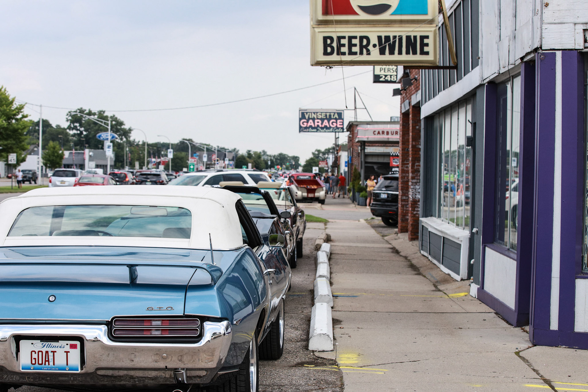 Classic cars line up in parking lots ahead of the Woodward Dream Cruise in Royal Oak on Thursday, August 19, 2021. The Woodward Dream Cruise, the world's largest one-day car event is returning after taking a break due to COVID-19.