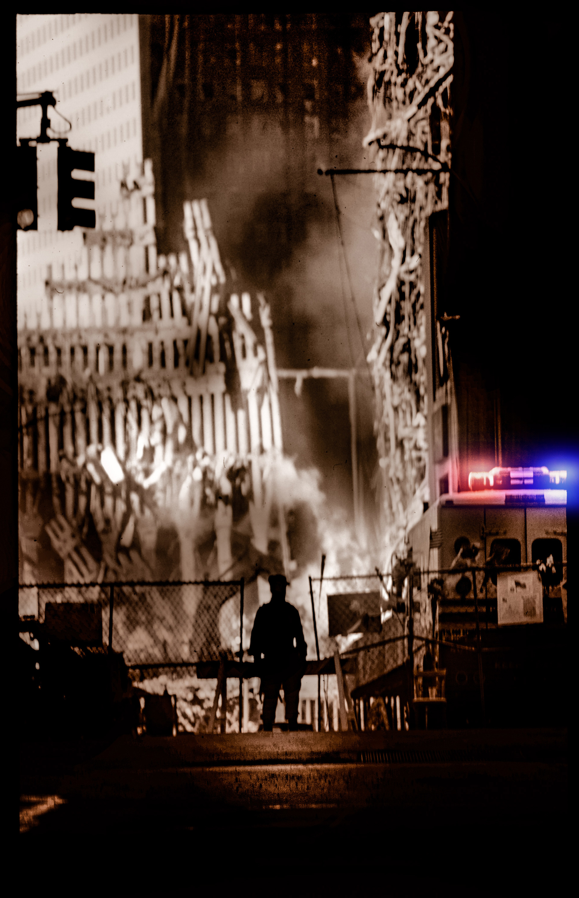A silhouette of a person stands on a dimly lit street, facing burning debris of a collapsed building. Smoke rises, with red and blue emergency lights nearby. The scene is somber and tense.